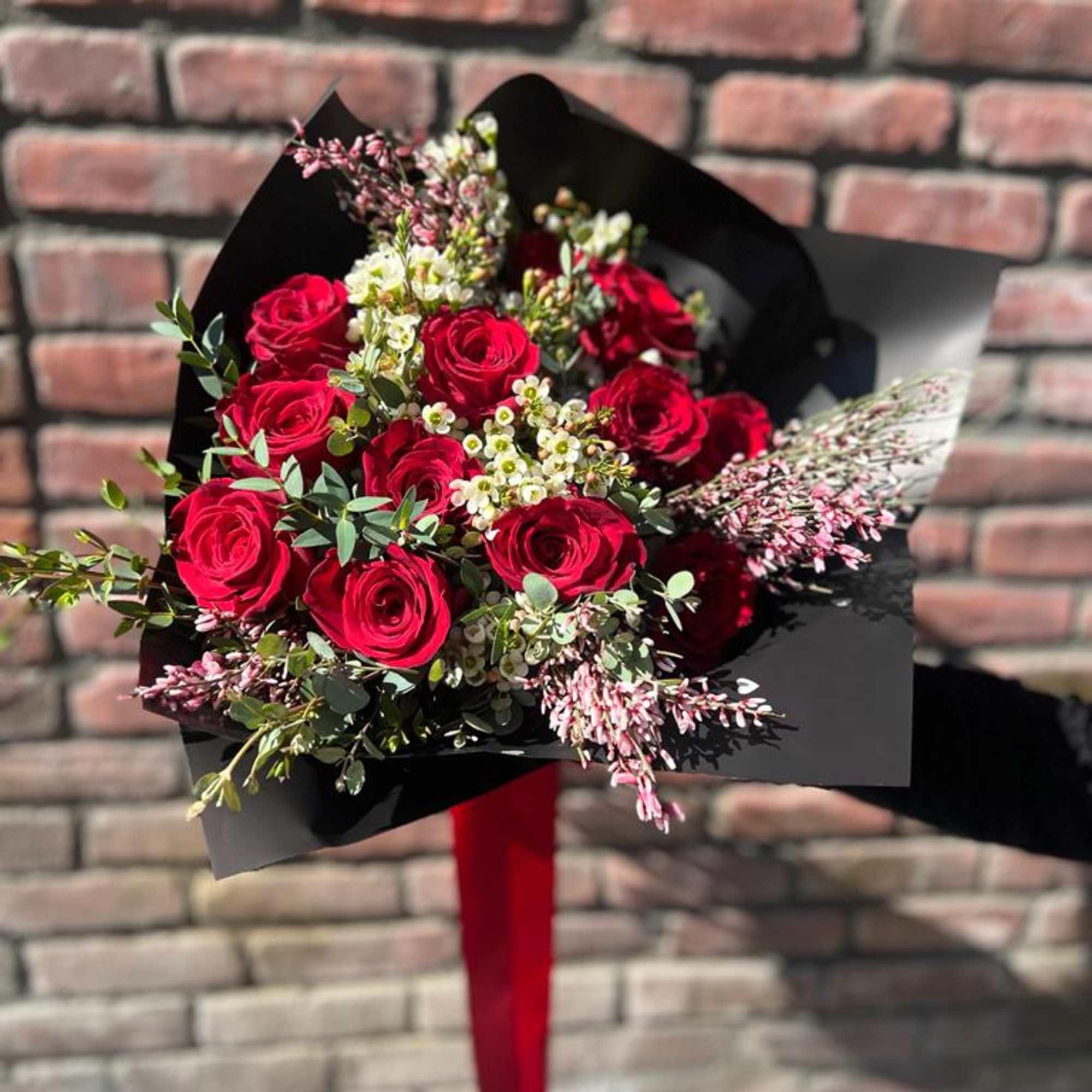 1 dozen red roses with wax flower ginestra flower  and a