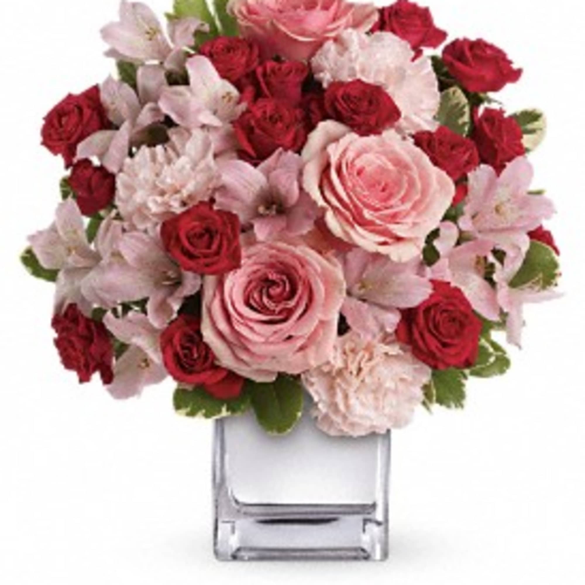 Passionately pretty in pink, this gorgeous array of pink and red roses