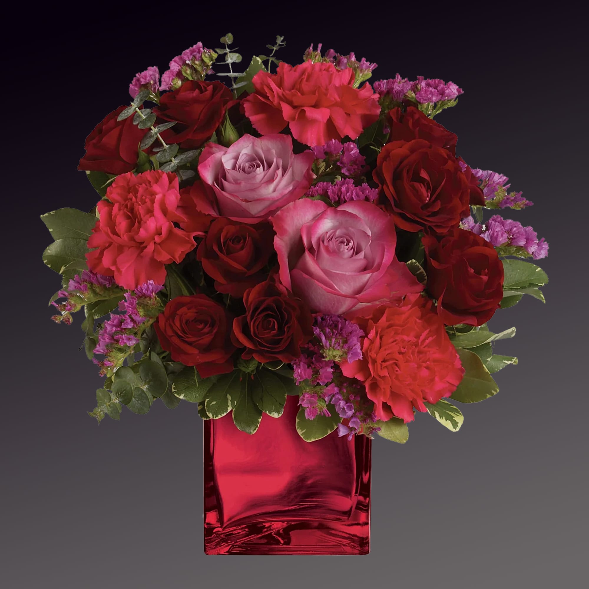 Enrapture your paramour with this dramatic display of red and lavender roses.