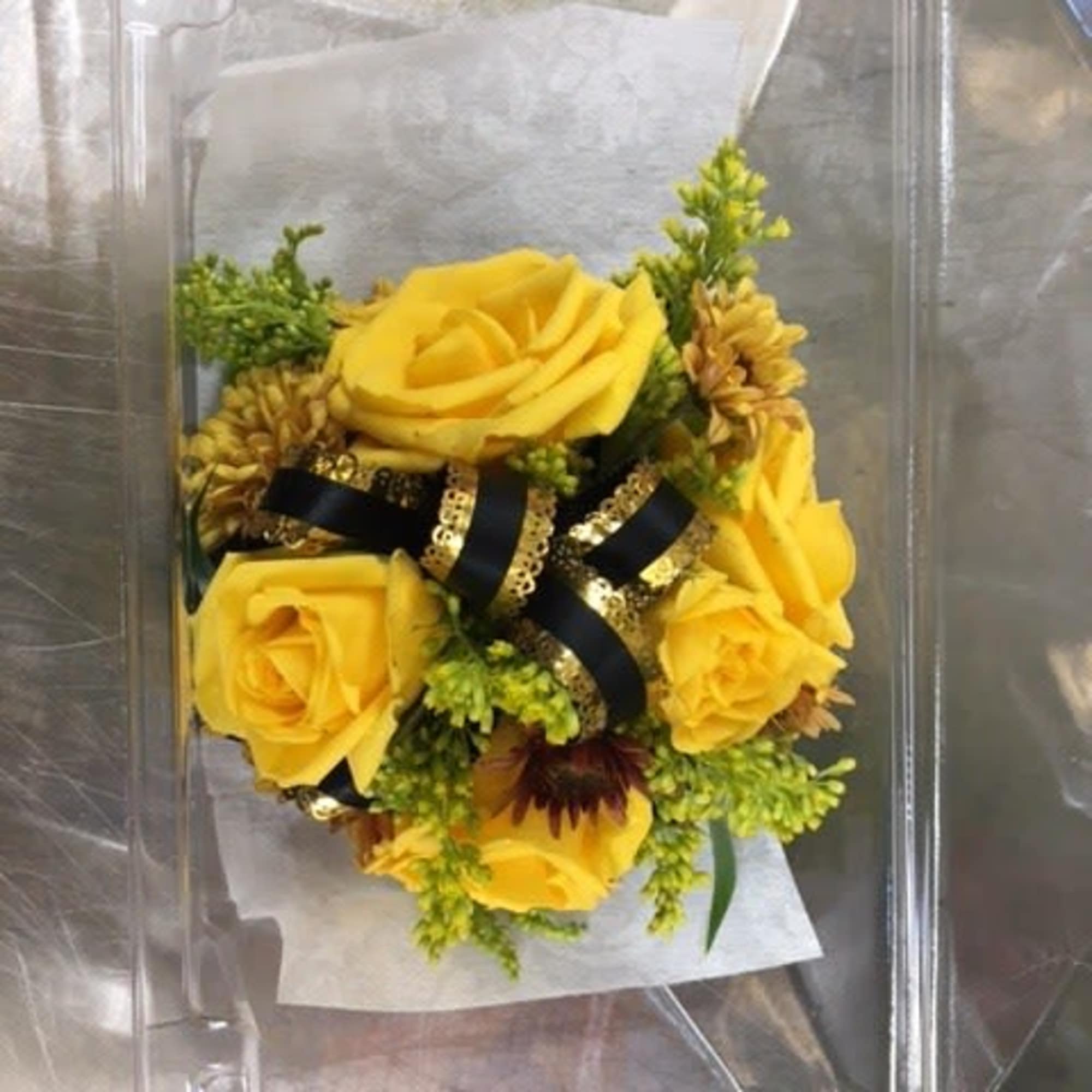 Yellow sweetheart roses, with brown mums, yellow solidago, black and gold bow