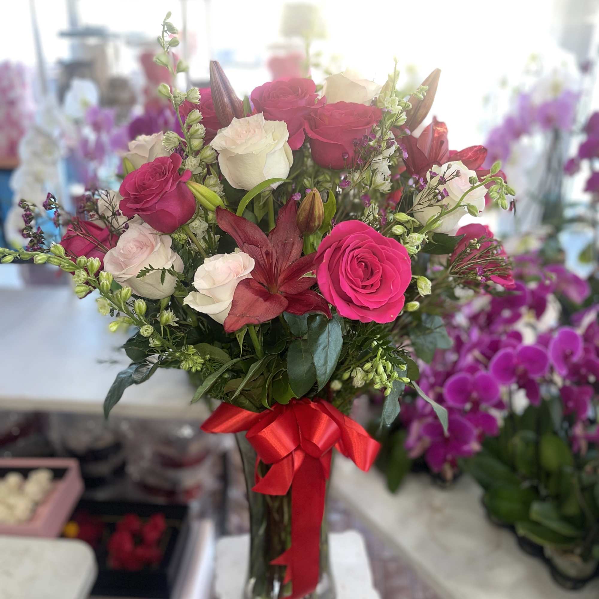 Lovely Tall Stemmed Mixed Flowers In a Beautiful Vase