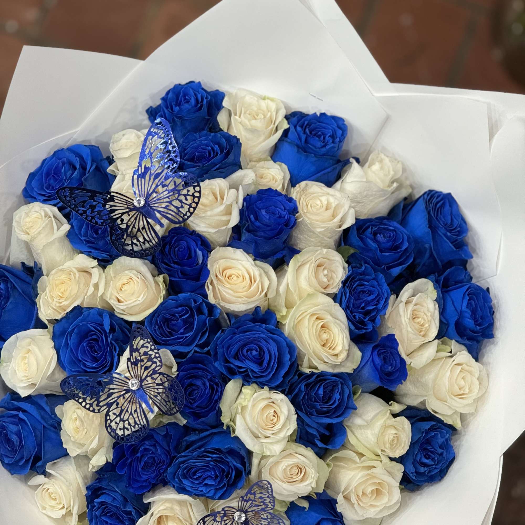 Beautiful royal blues mixed with right roses to create a beautiful bouquet