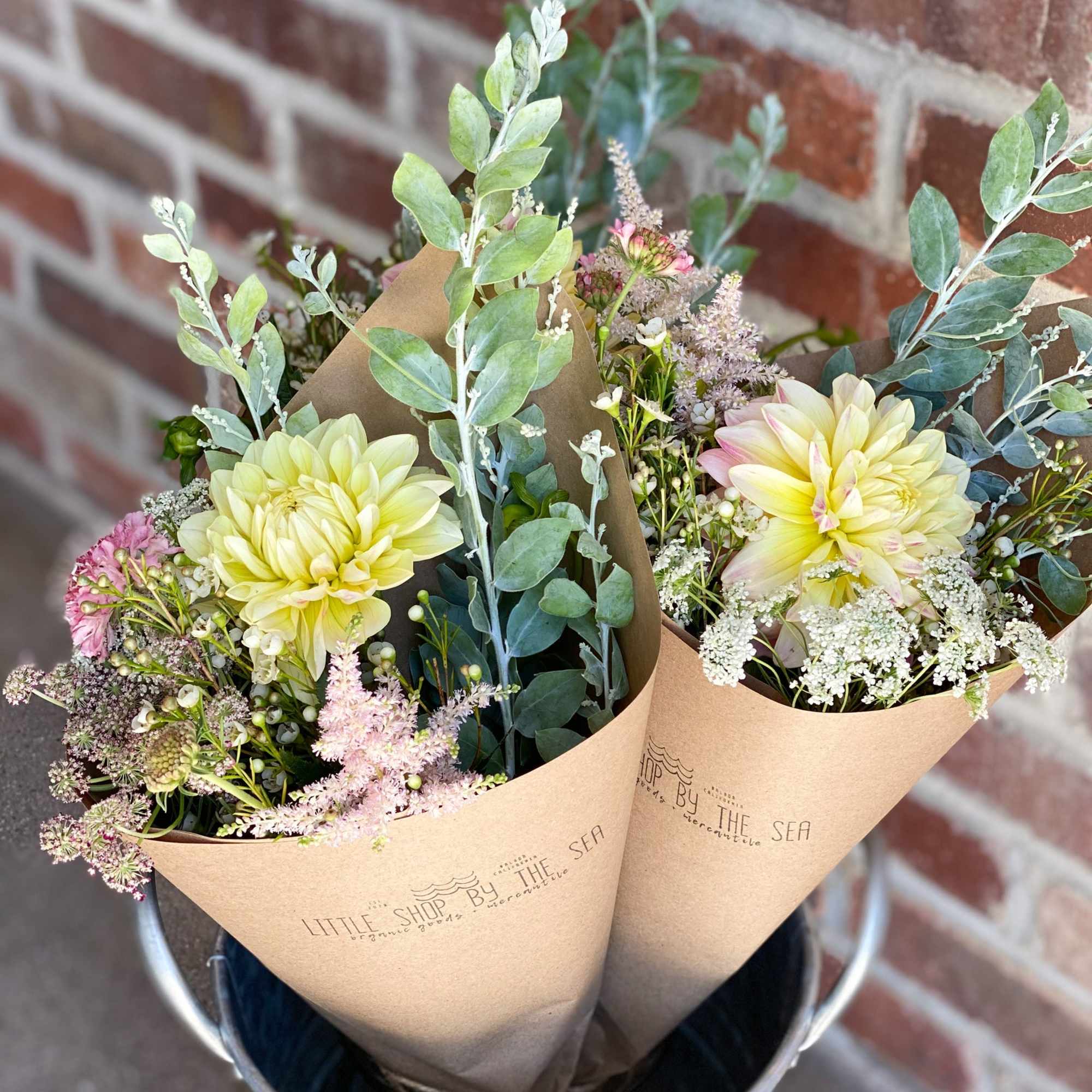 Enjoy our signature paper wrapped style, hand tied and filled with the