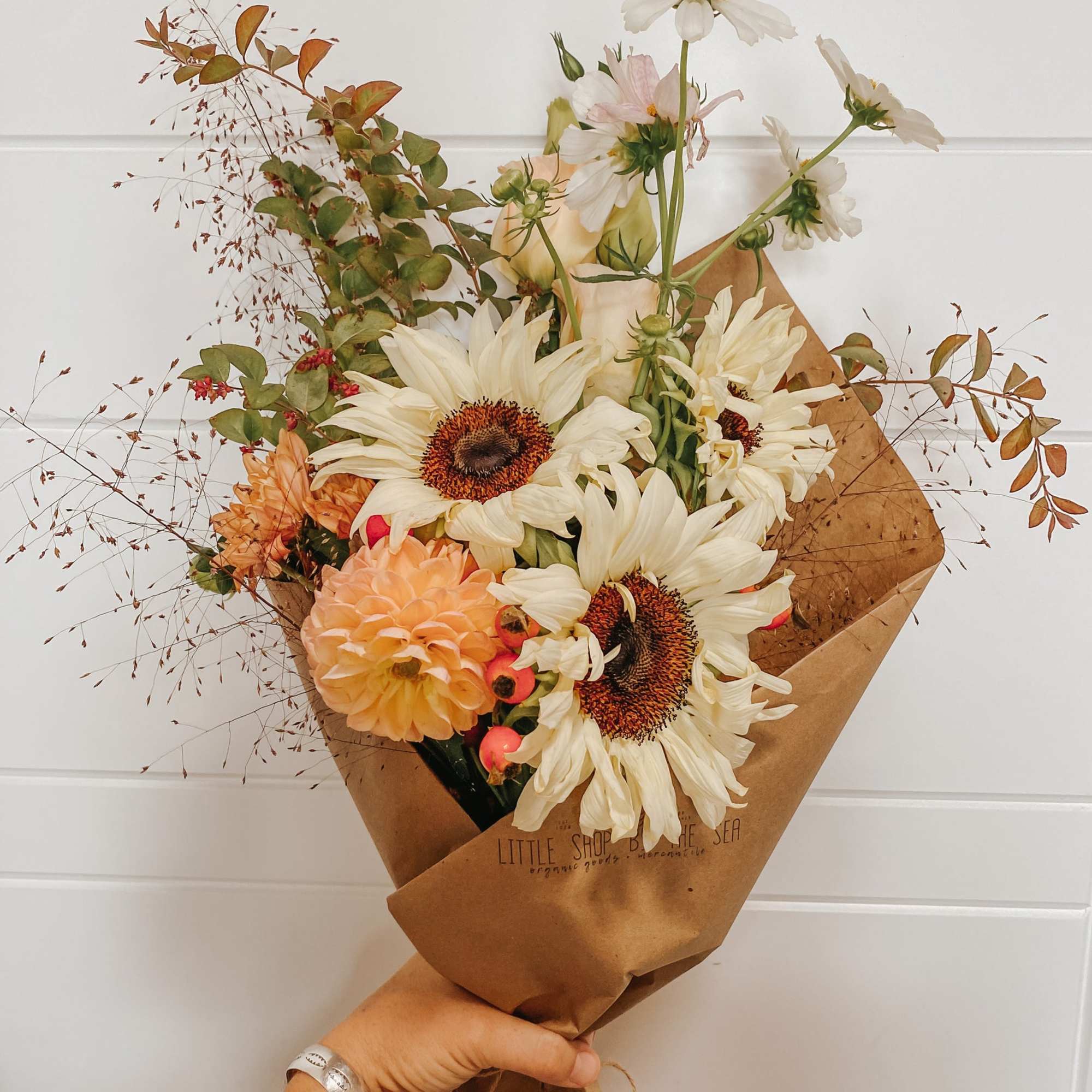 Enjoy our signature paper wrapped style, hand tied and filled with the