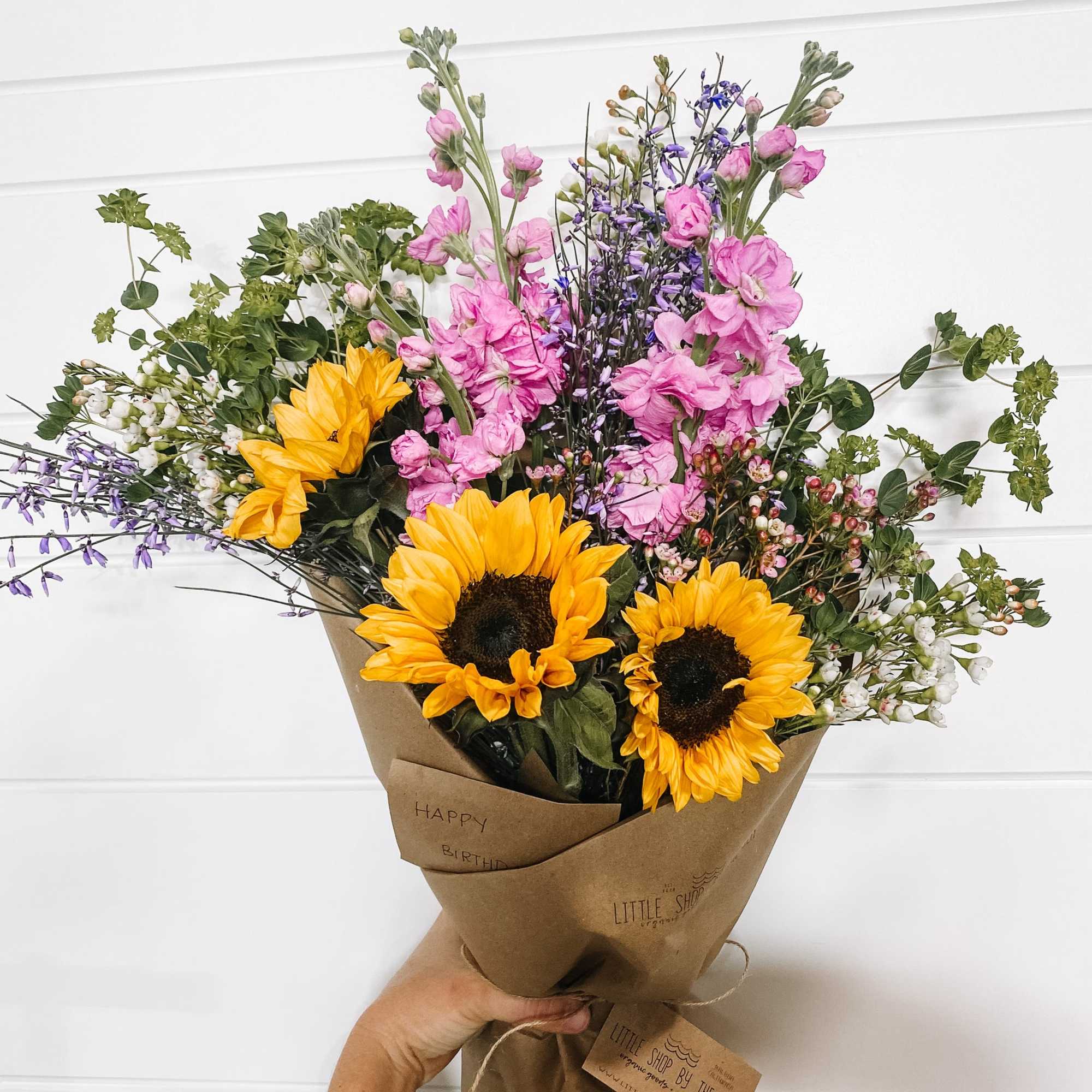 Enjoy our signature paper wrapped style, hand tied and filled with the