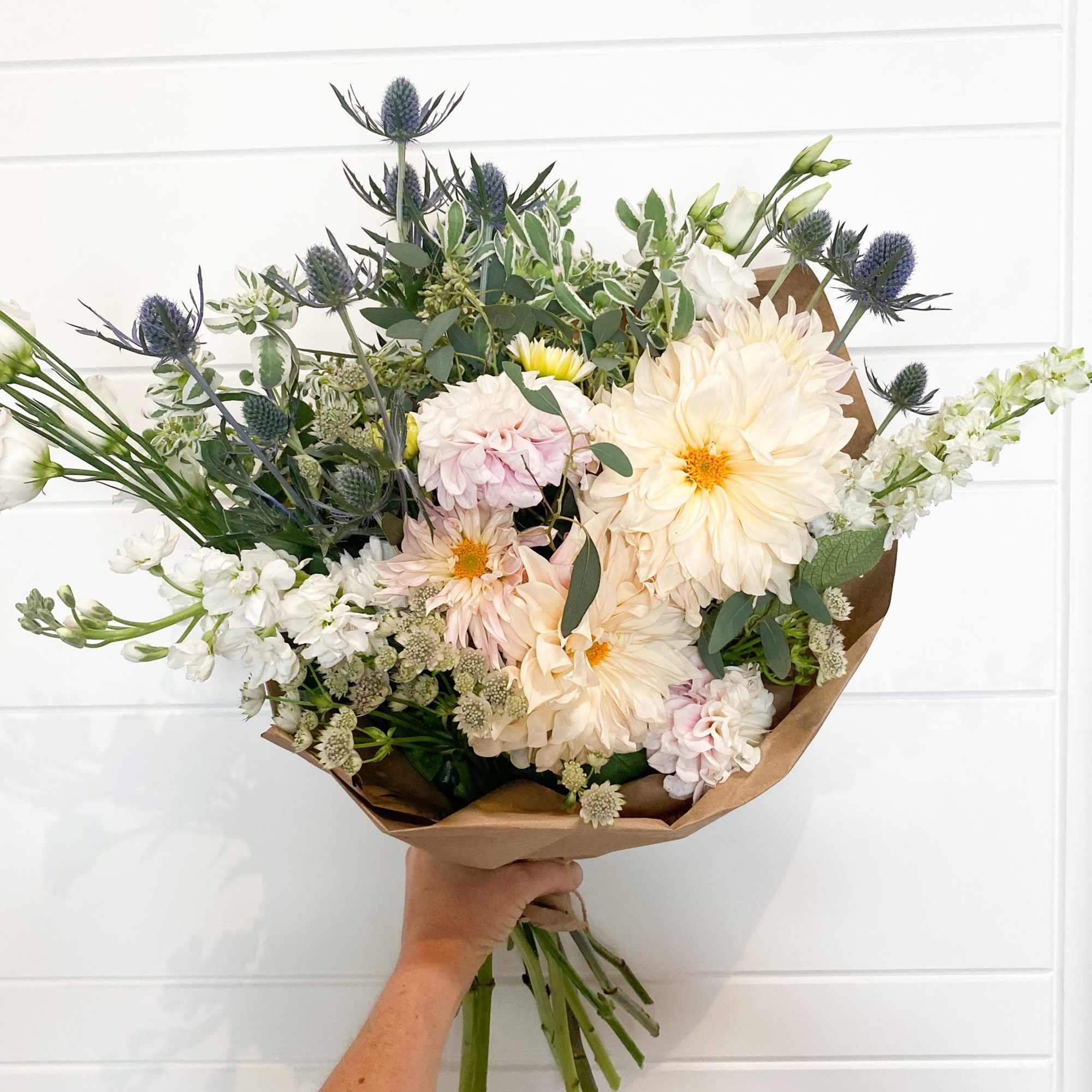 Enjoy our signature paper wrapped style, hand tied and filled with the