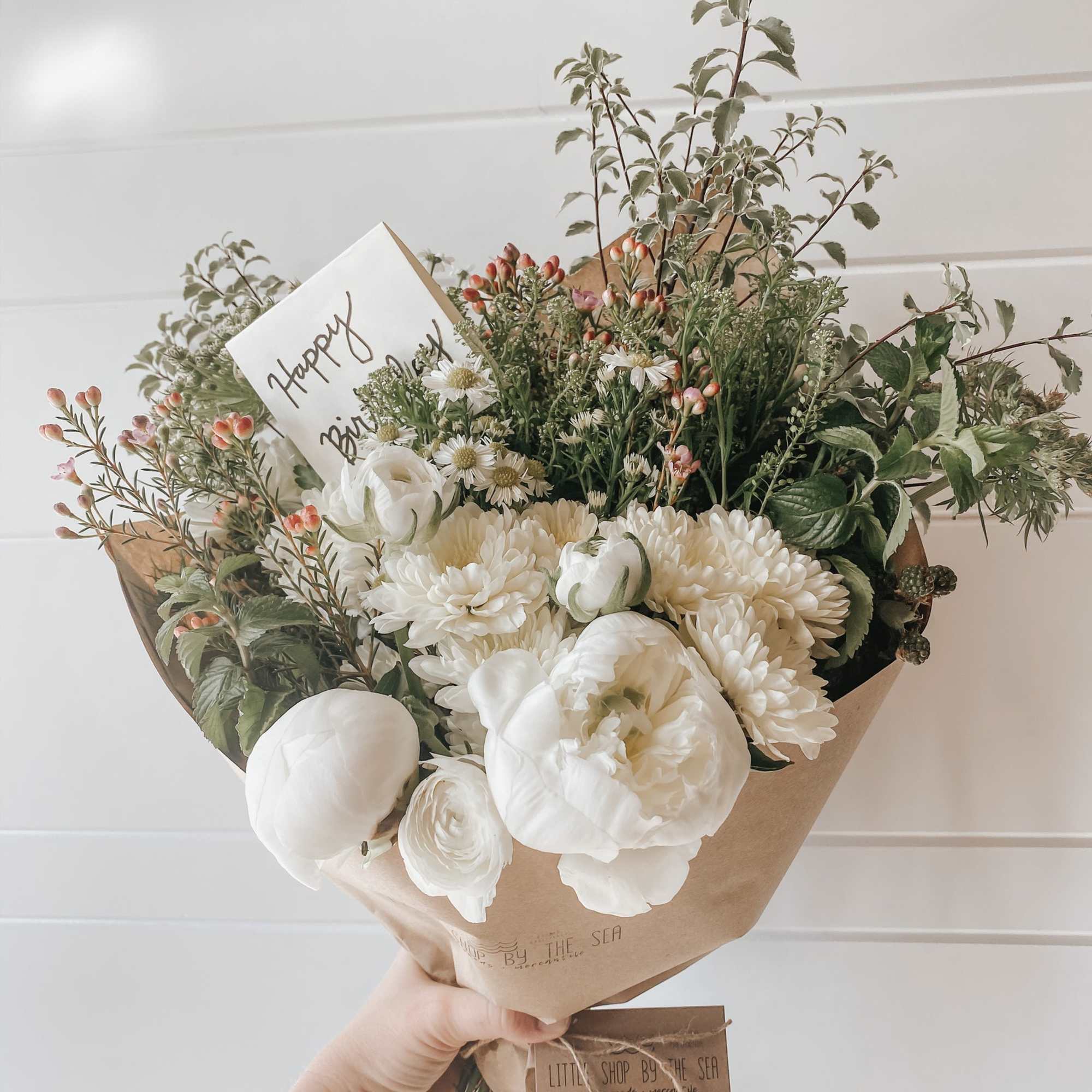 Enjoy our signature paper wrapped style, hand tied and filled with the