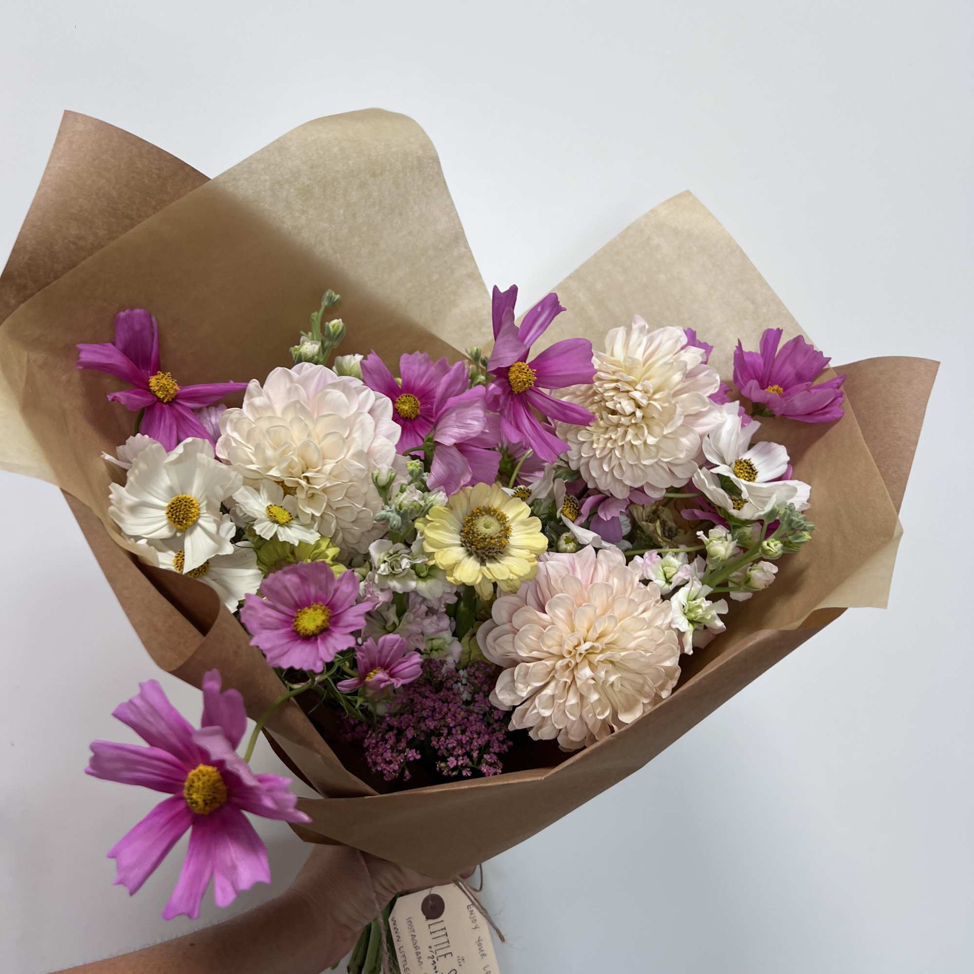 Enjoy our signature paper wrapped style, hand tied and filled with the