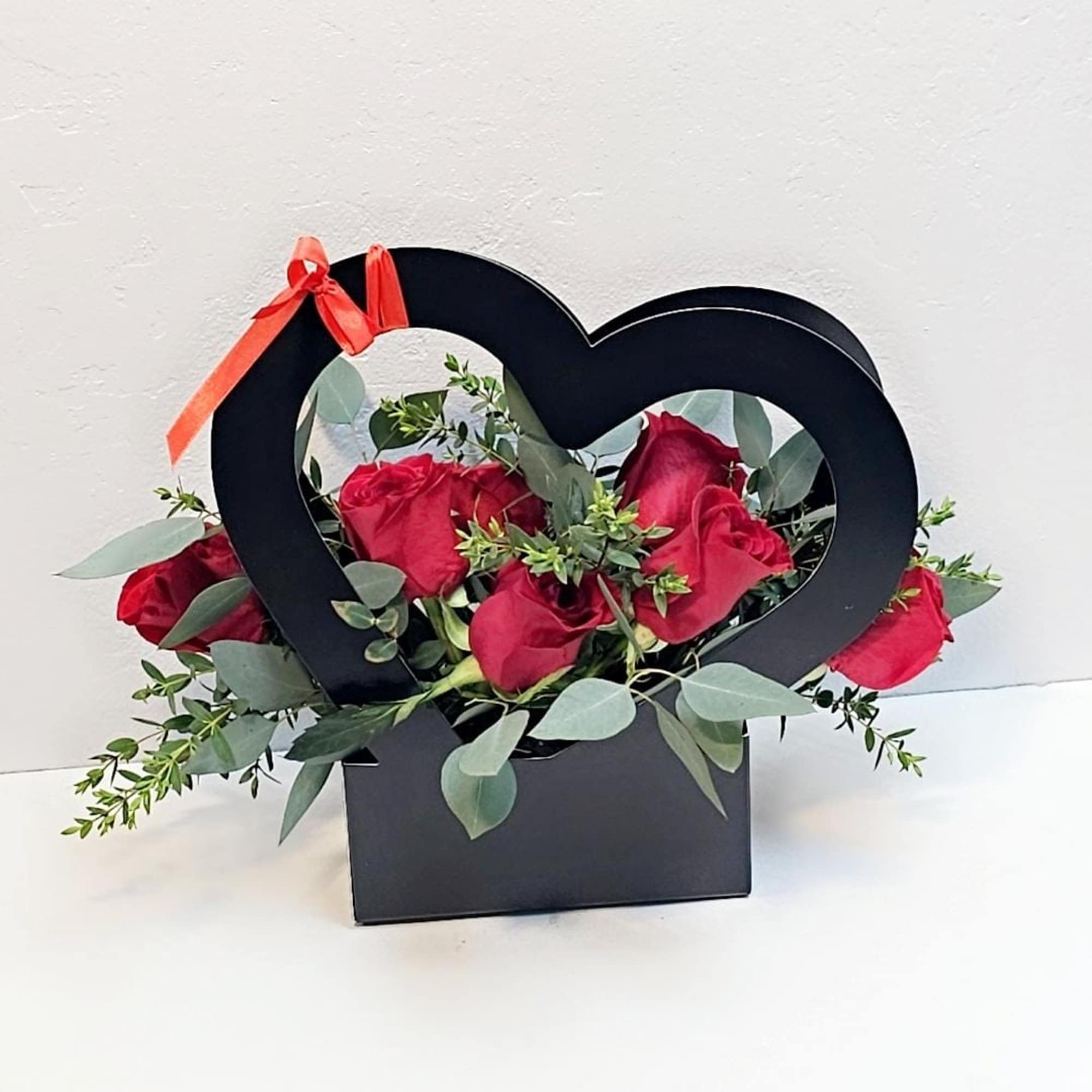 Crafted heart shap bag with handles 