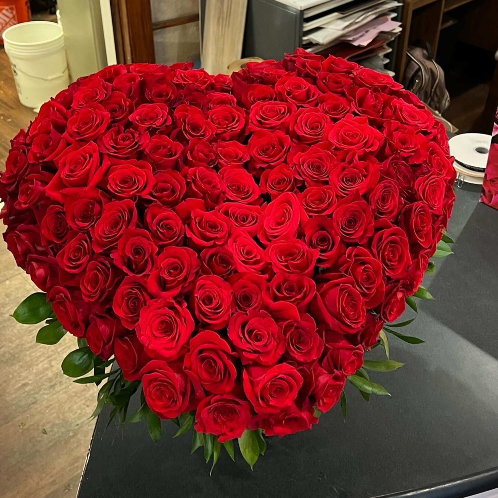  A large heart covered in red roses.

The base is all rose