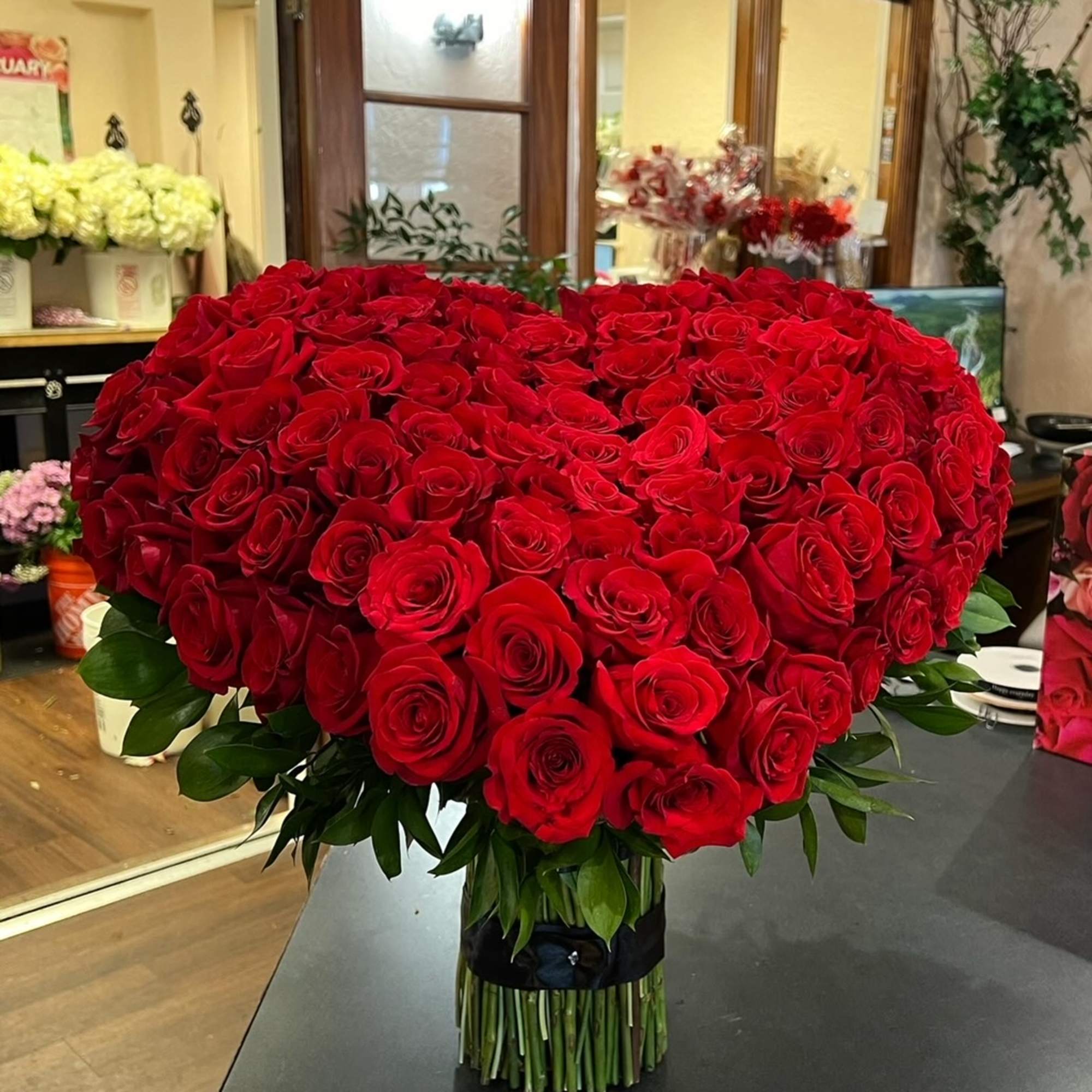  A large heart covered in red roses.

The base is all rose