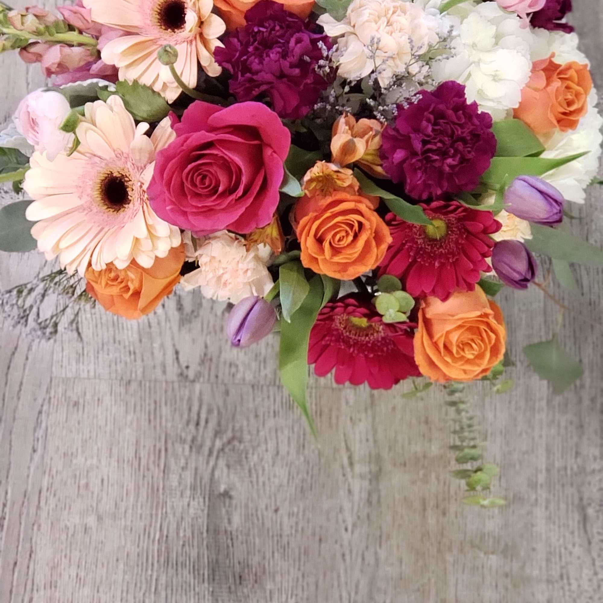 A beautiful mix of seasonal flowers Rose&#039;s, ranunculus, kale, carnations, tulips, snap