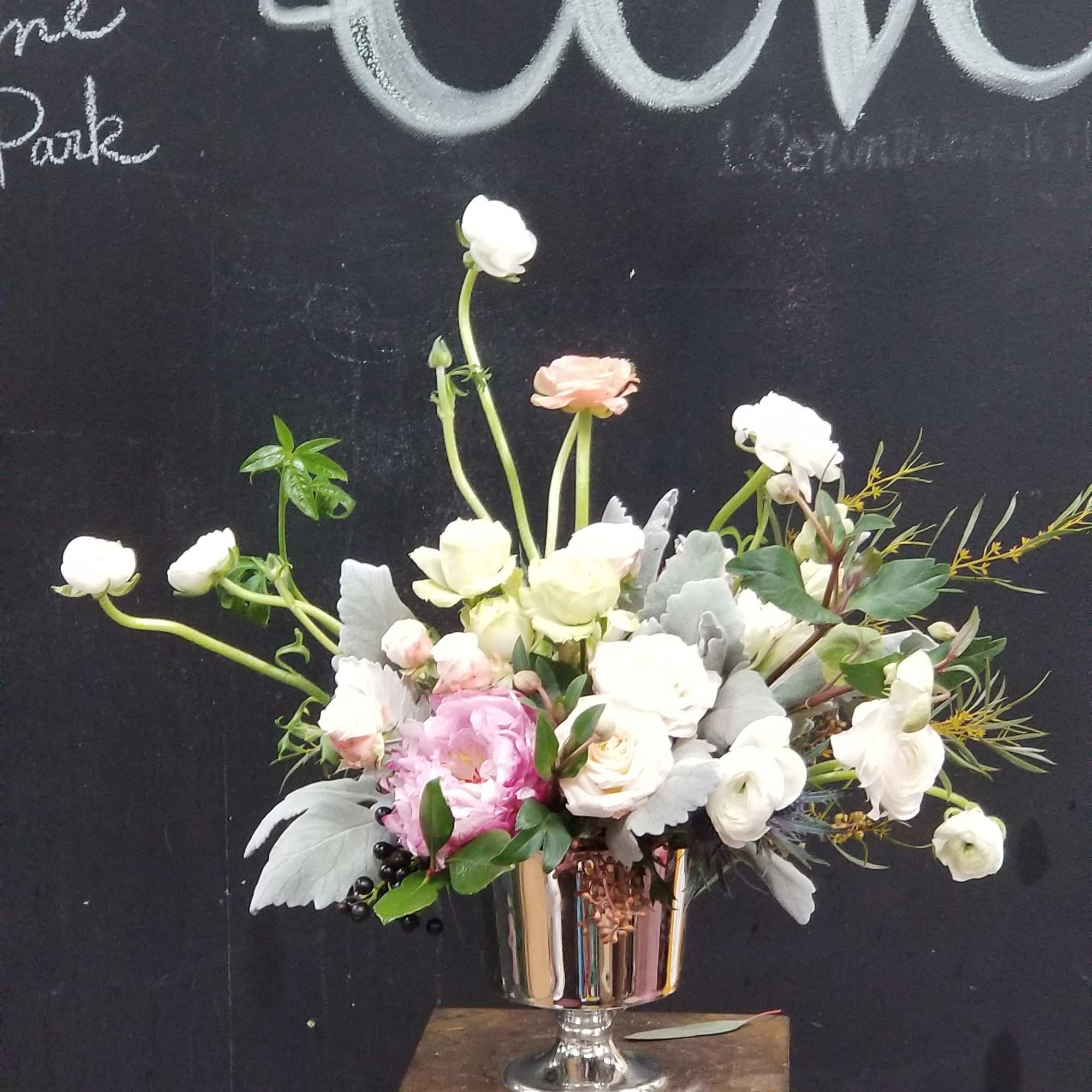 Beautiful and elegant white flowers in silver container perfect gift for who