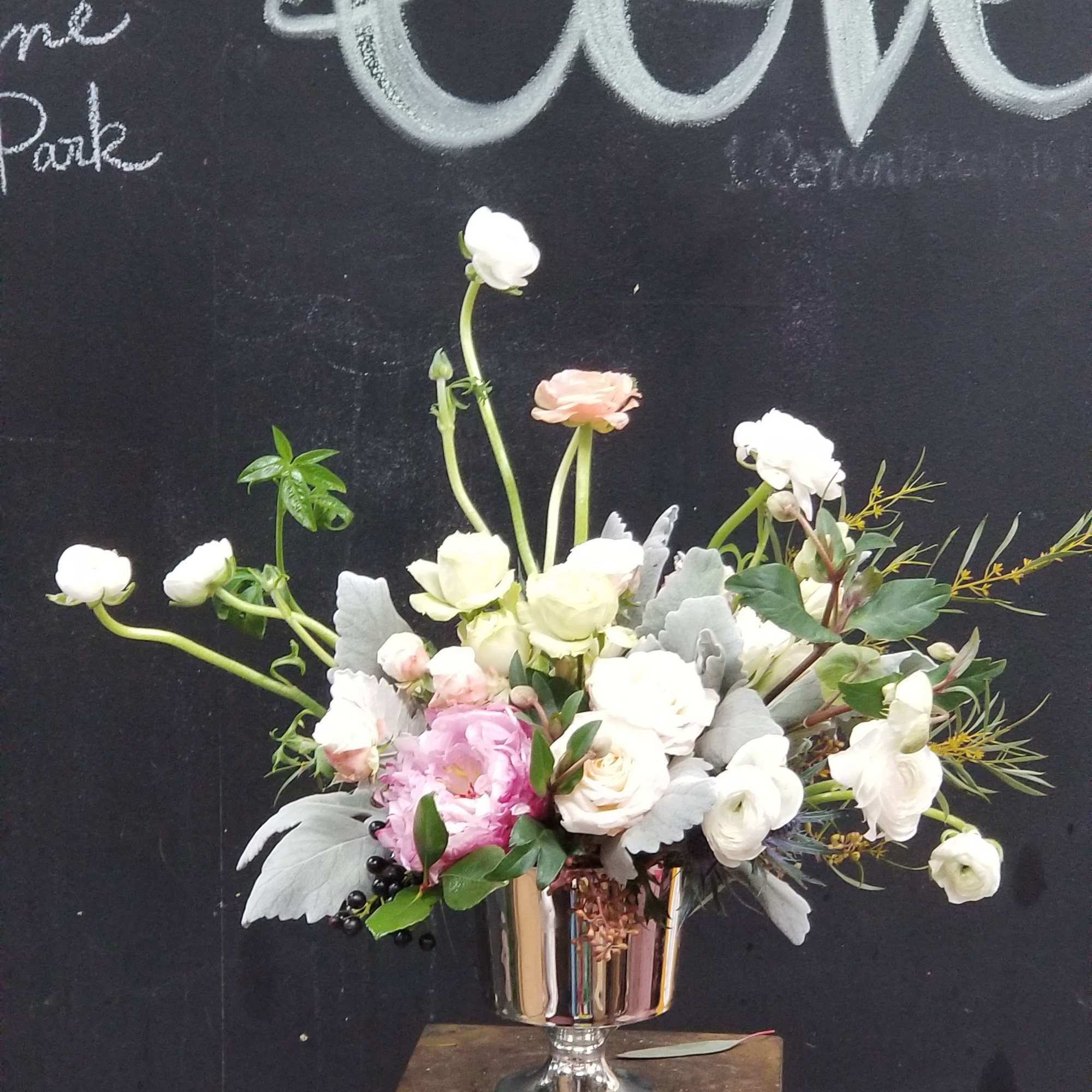 Beautiful and elegant white flowers in silver container perfect gift for who