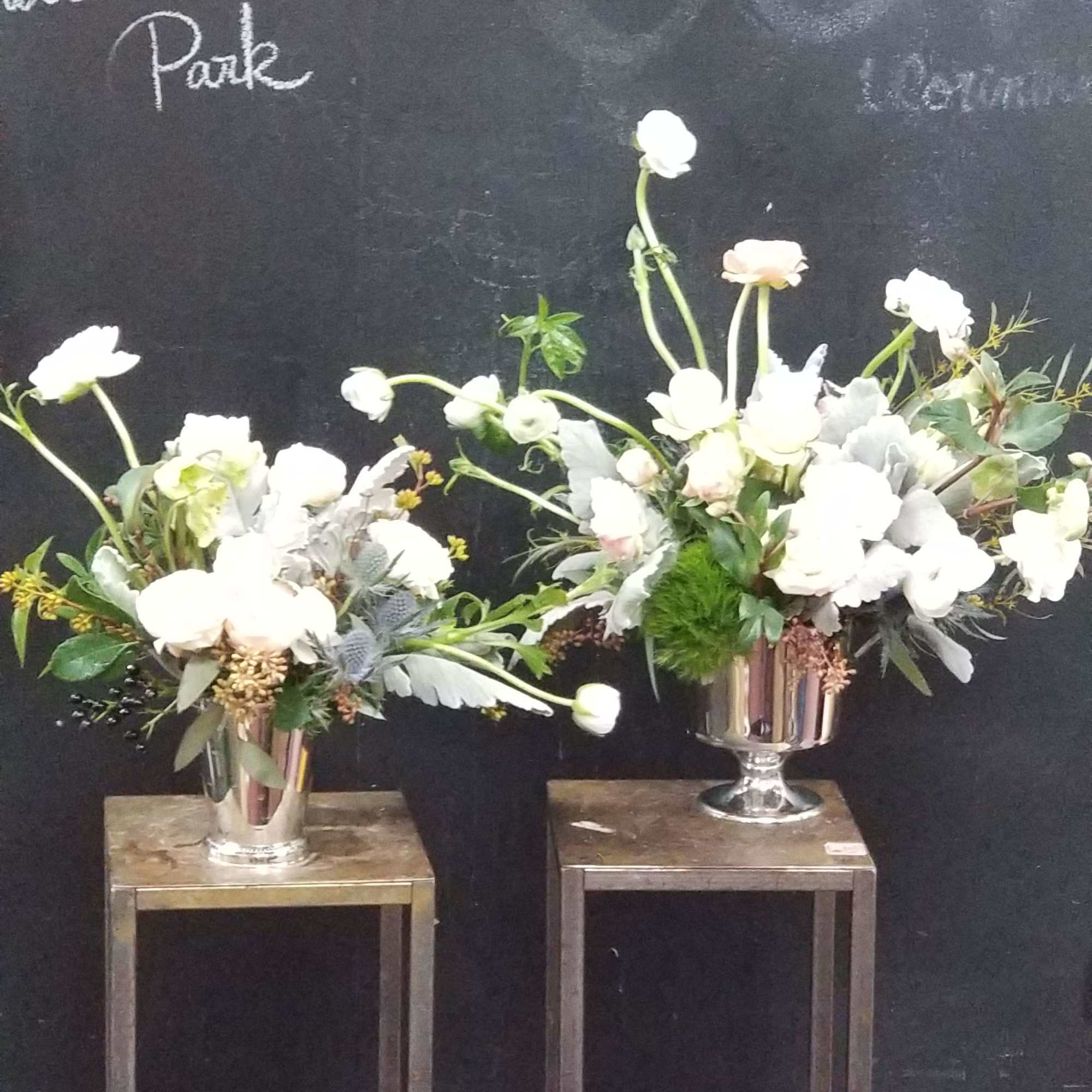 Beautiful and elegant white flowers in silver container perfect gift for who