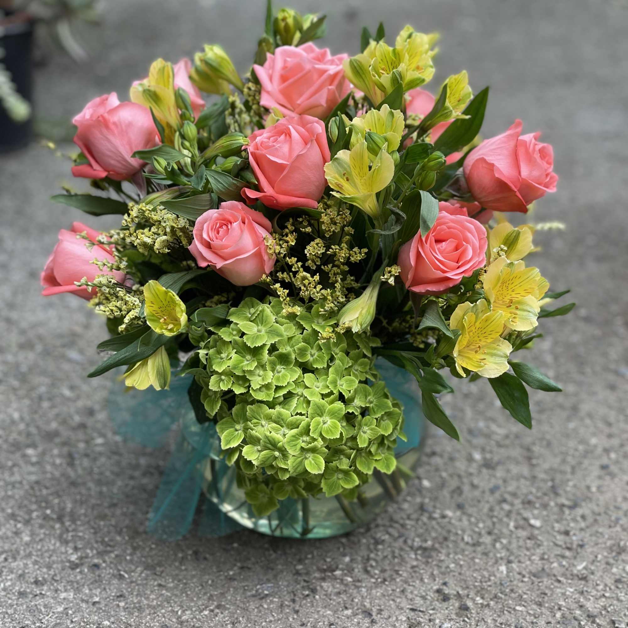 Peach Roses, Green, Yellow Alstromerias with filler arranged in a bubble clear Peach Roses, Green, Yellow Alstromerias with filler arranged in a bubble clear
