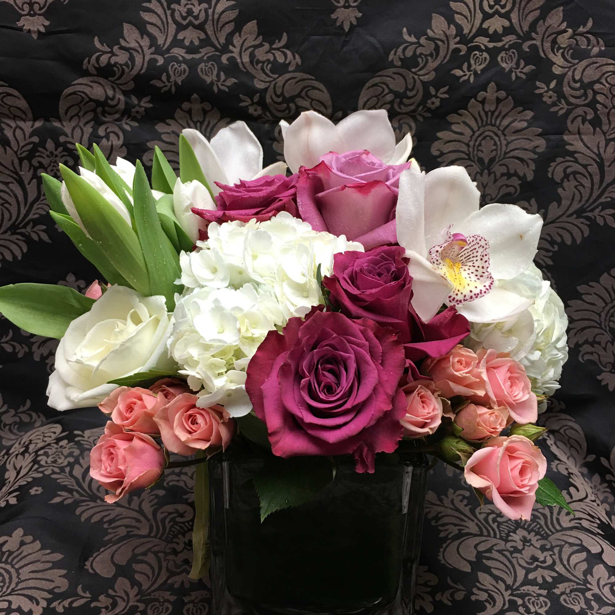 Classic and Beautiful, this large arrangement whispers luxury. Soft pinks, whites and
