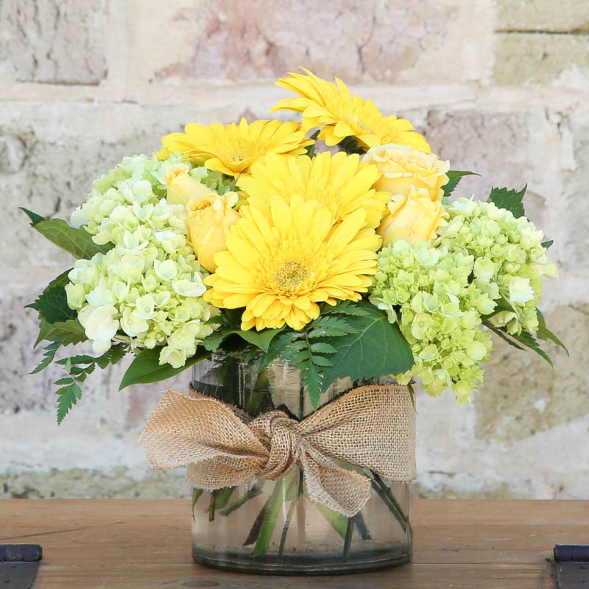 THREE GREEN HYDRANGEA WITH YELLOW GERBERAS AND ROSES.
