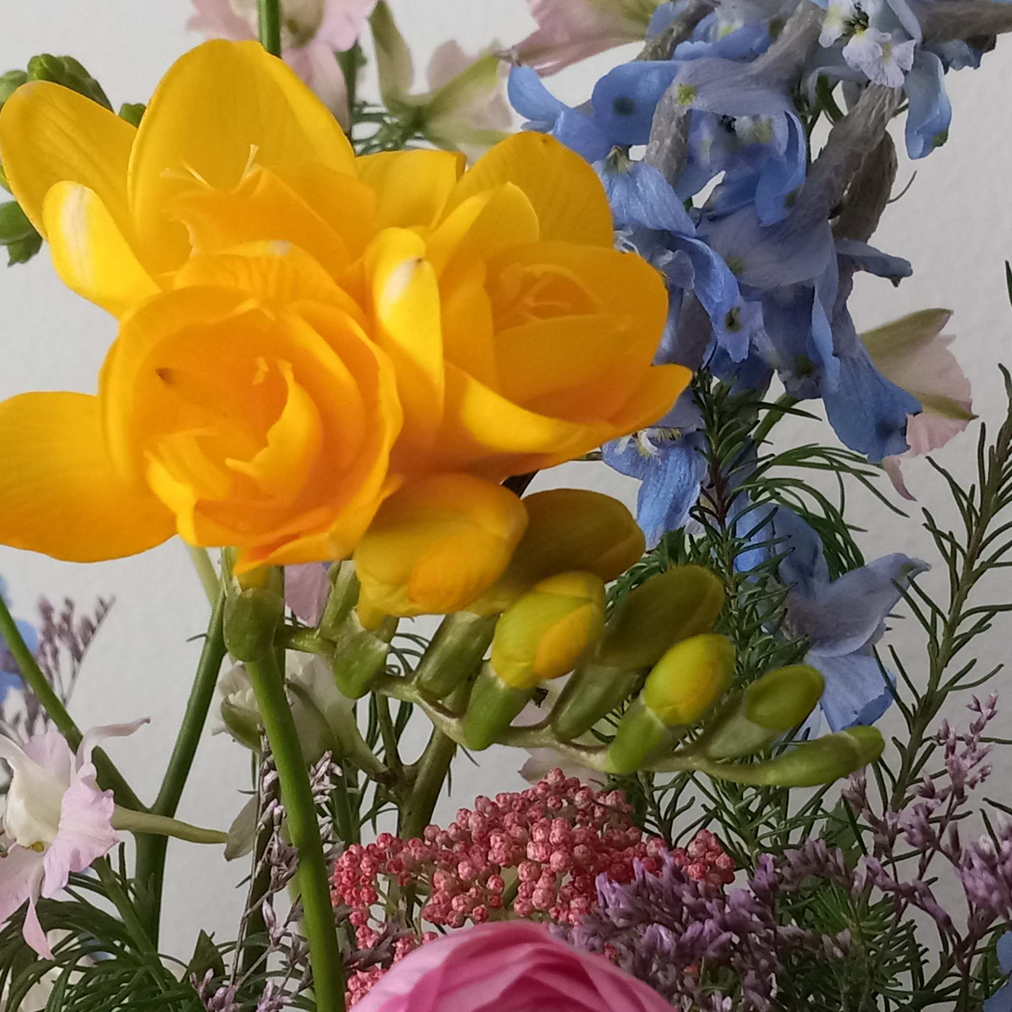 Like wispy clouds in a bright blue sky, this beautiful bouquet of