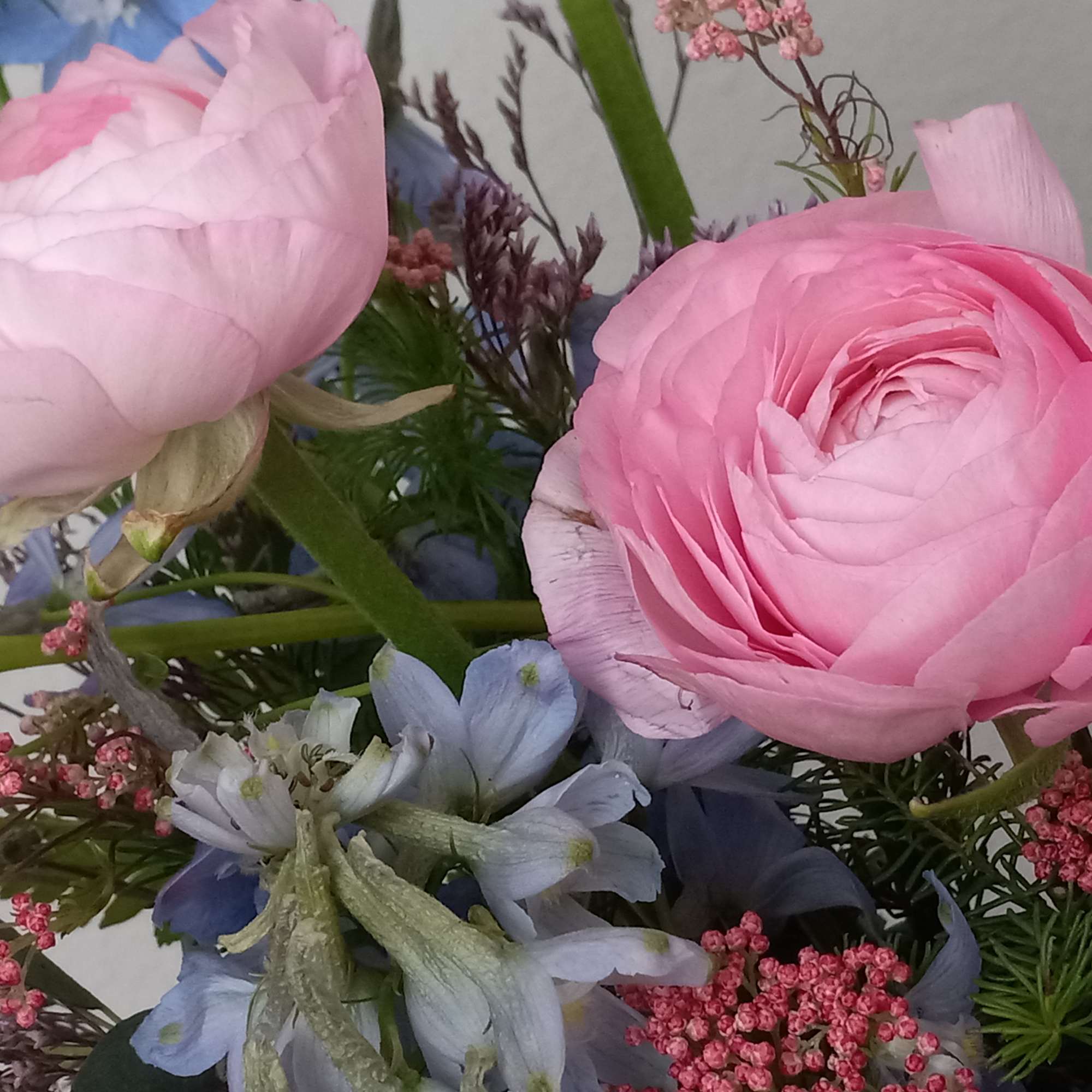 Like wispy clouds in a bright blue sky, this beautiful bouquet of