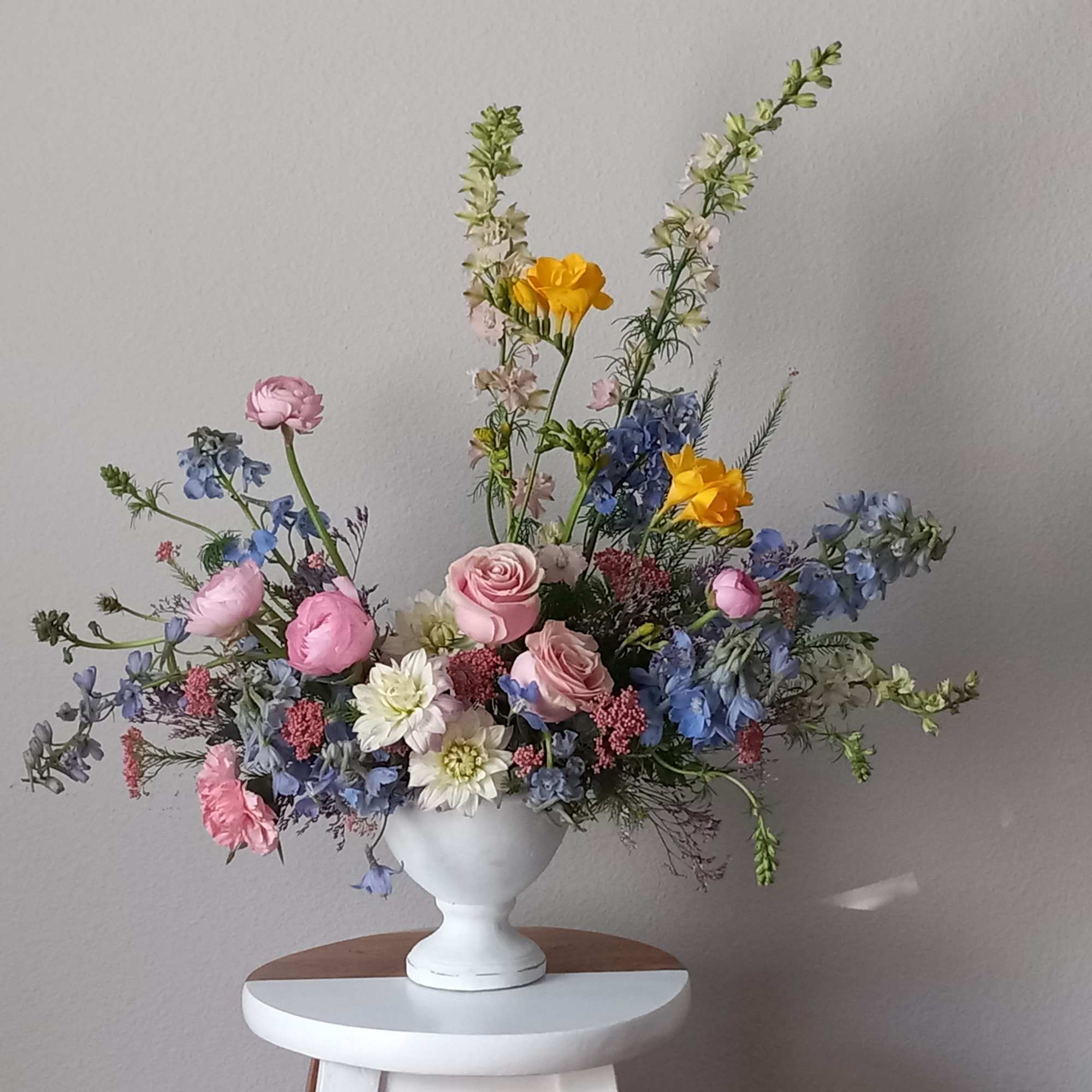 Like wispy clouds in a bright blue sky, this beautiful bouquet of