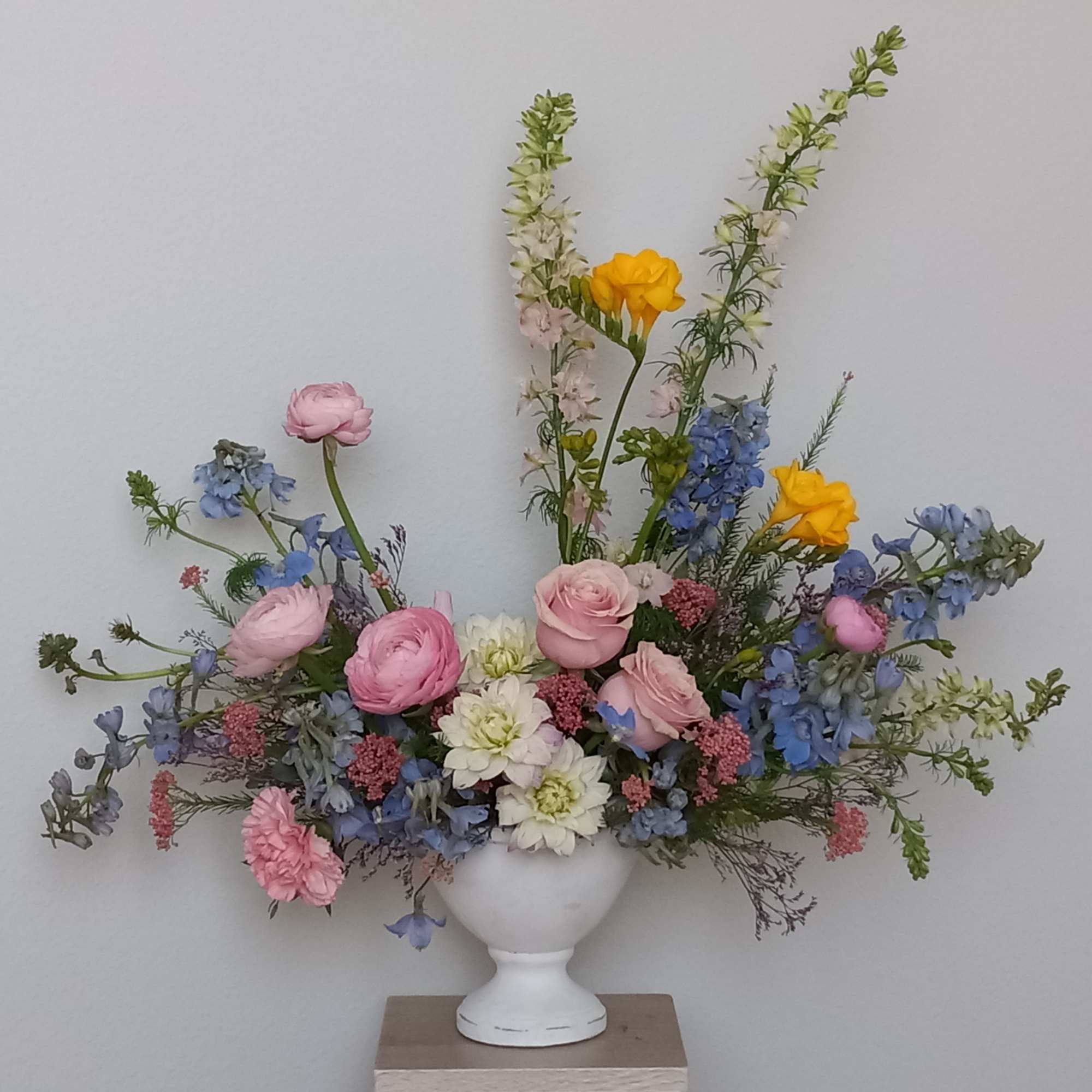 Like wispy clouds in a bright blue sky, this beautiful bouquet of