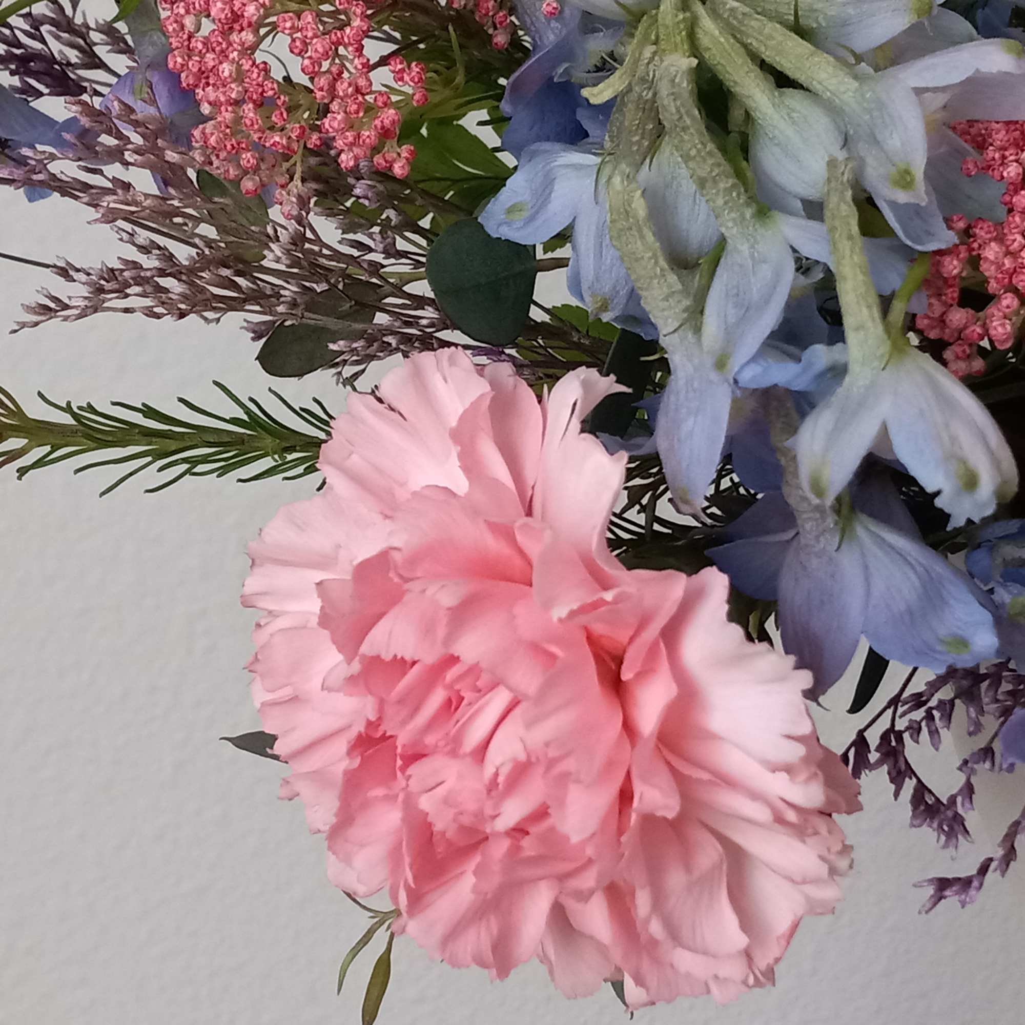 Like wispy clouds in a bright blue sky, this beautiful bouquet of