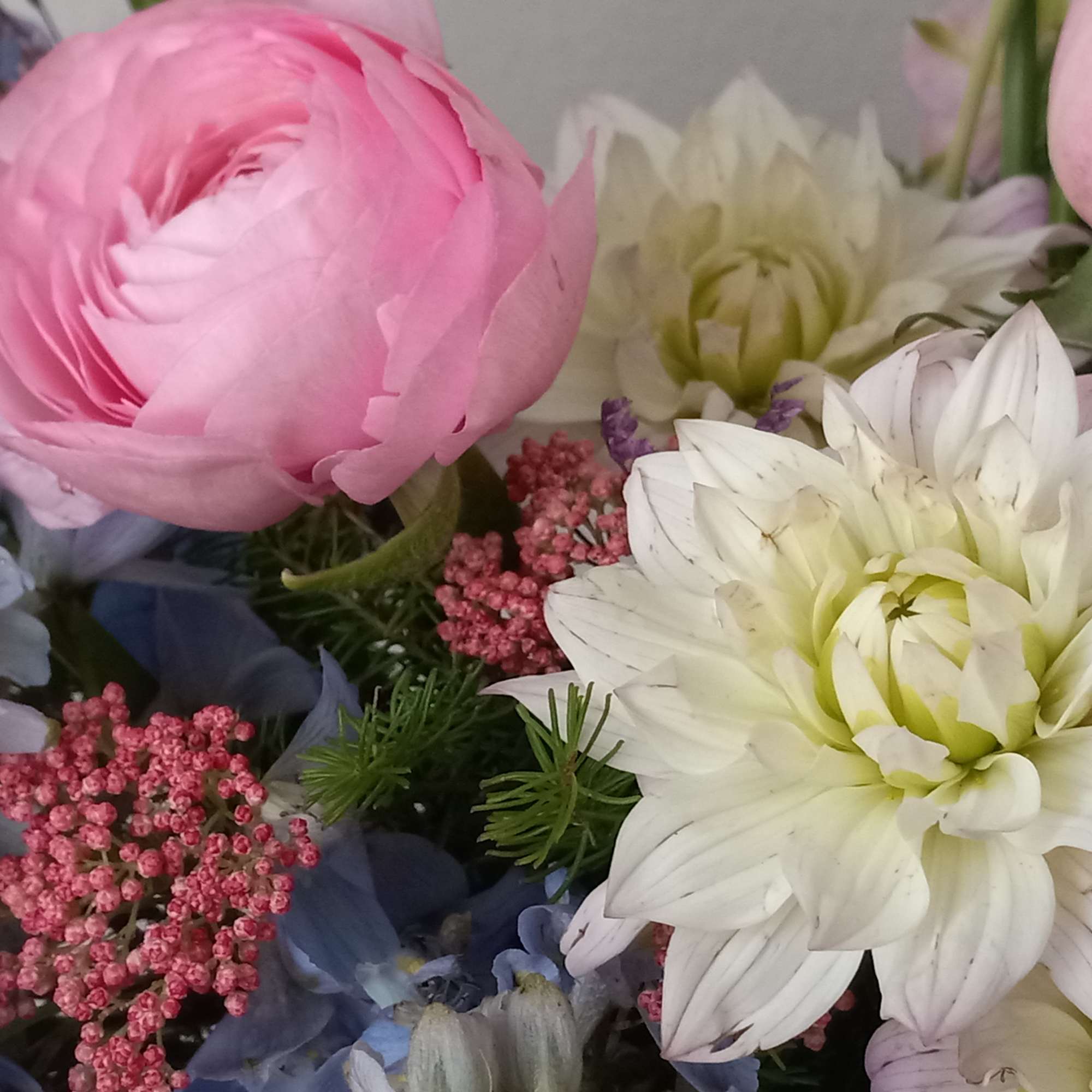 Like wispy clouds in a bright blue sky, this beautiful bouquet of