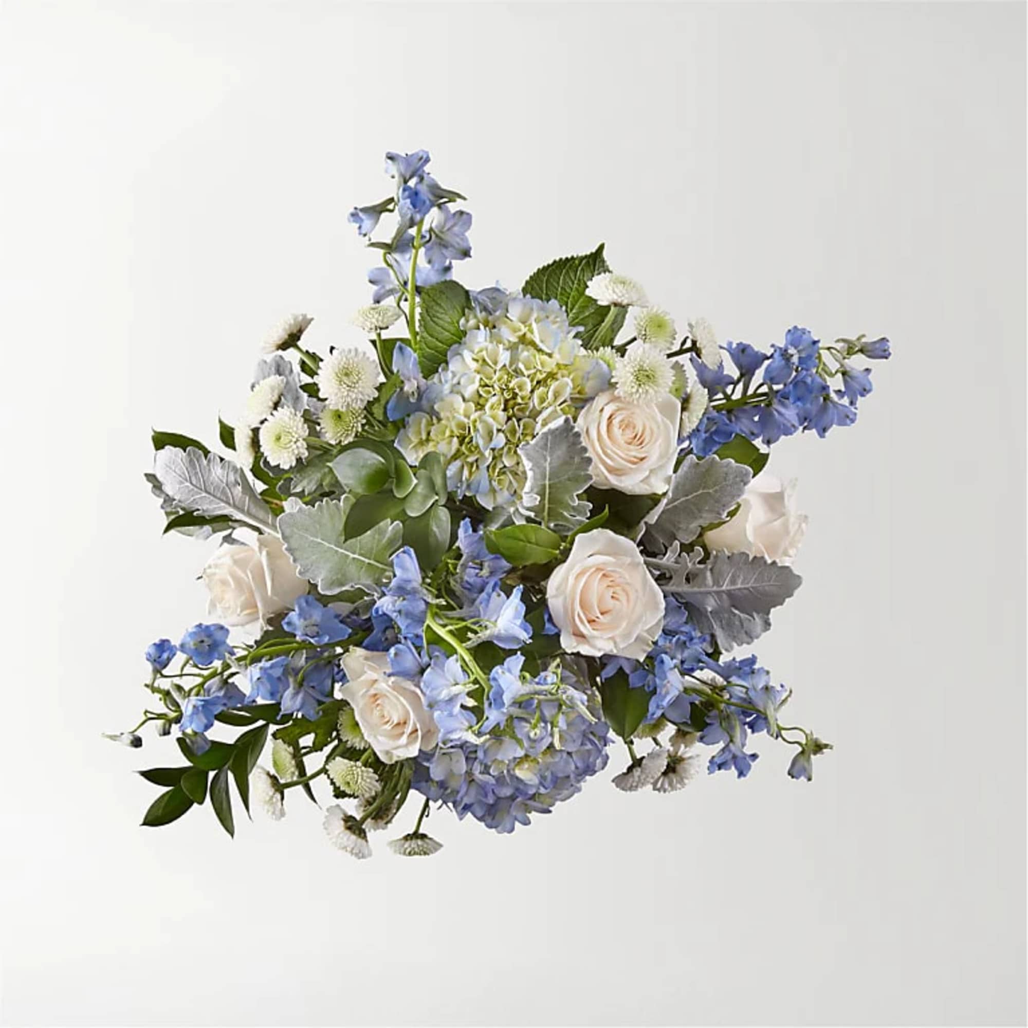 Let this uplifting arrangement be reminders of the clear skies ahead. Capturing