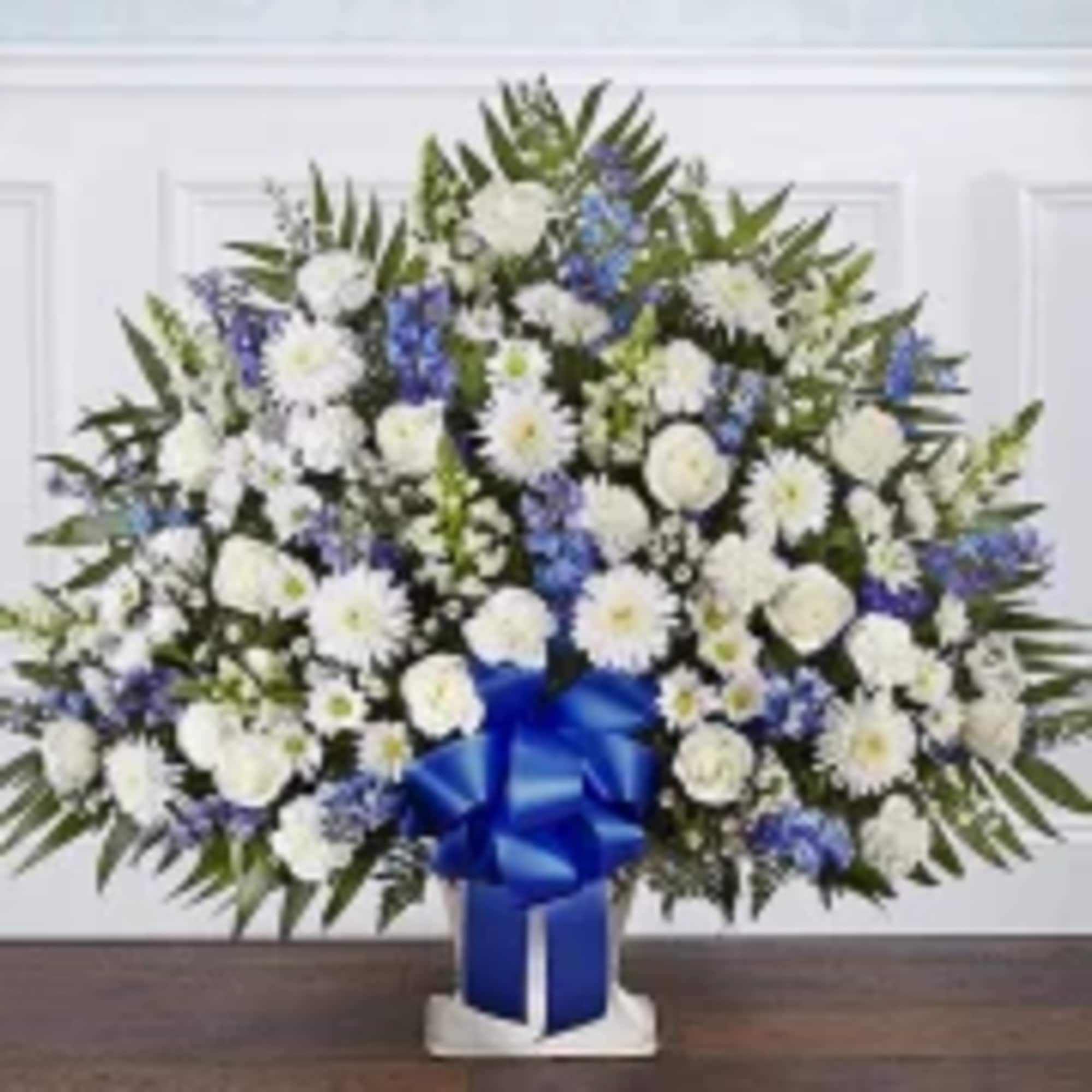 Our elegant floor basket arrangement, handcrafted by our caring florists with pristine