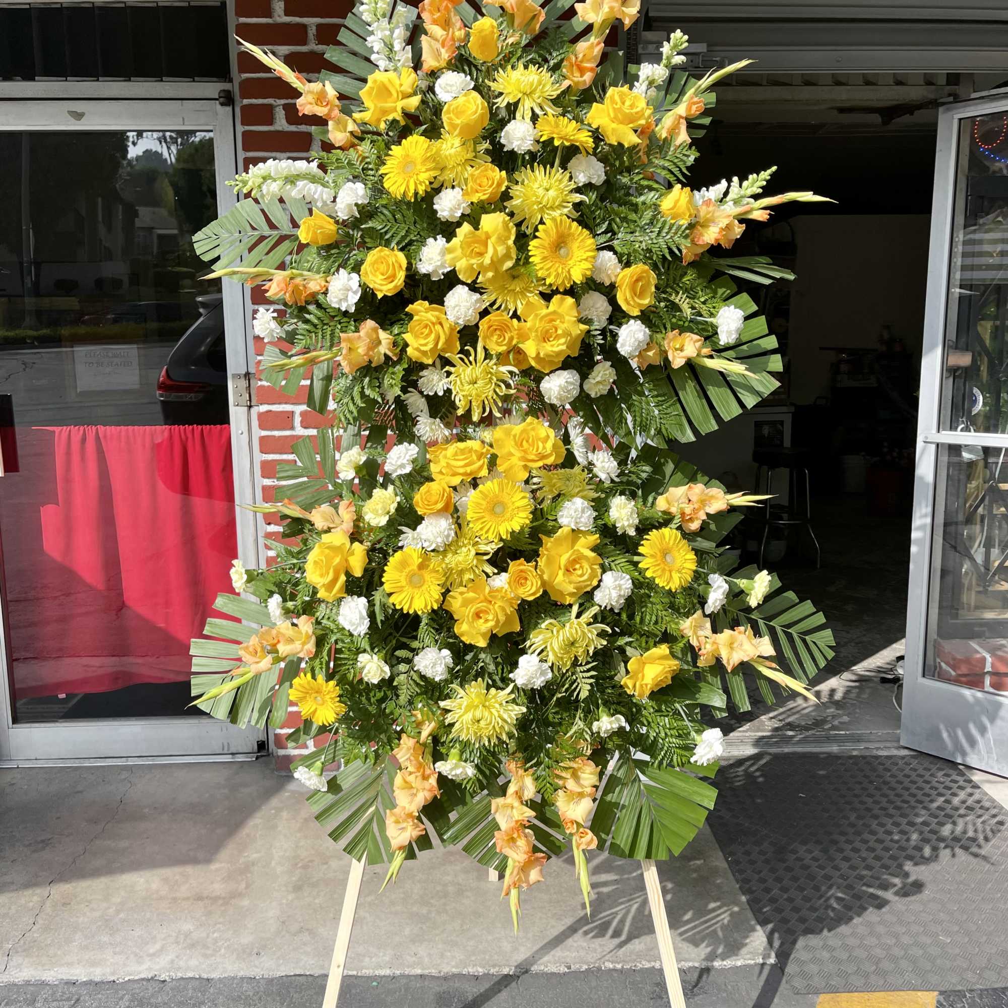 Show support for your loved ones with this vibrant yellow standing spray.
The Show support for your loved ones with this vibrant yellow standing spray.
The
