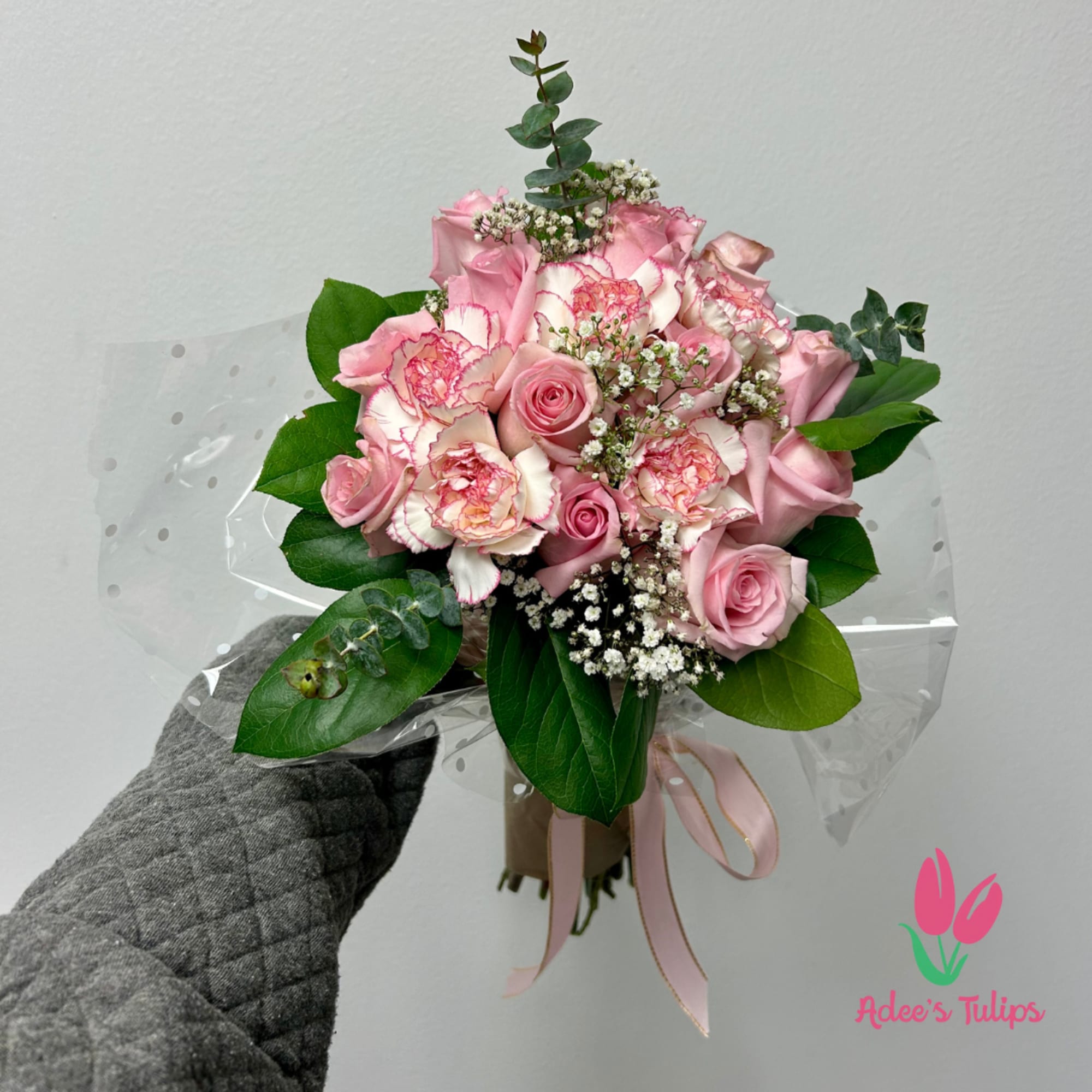 A dozen pink roses and pink and white carnations, perfect for that