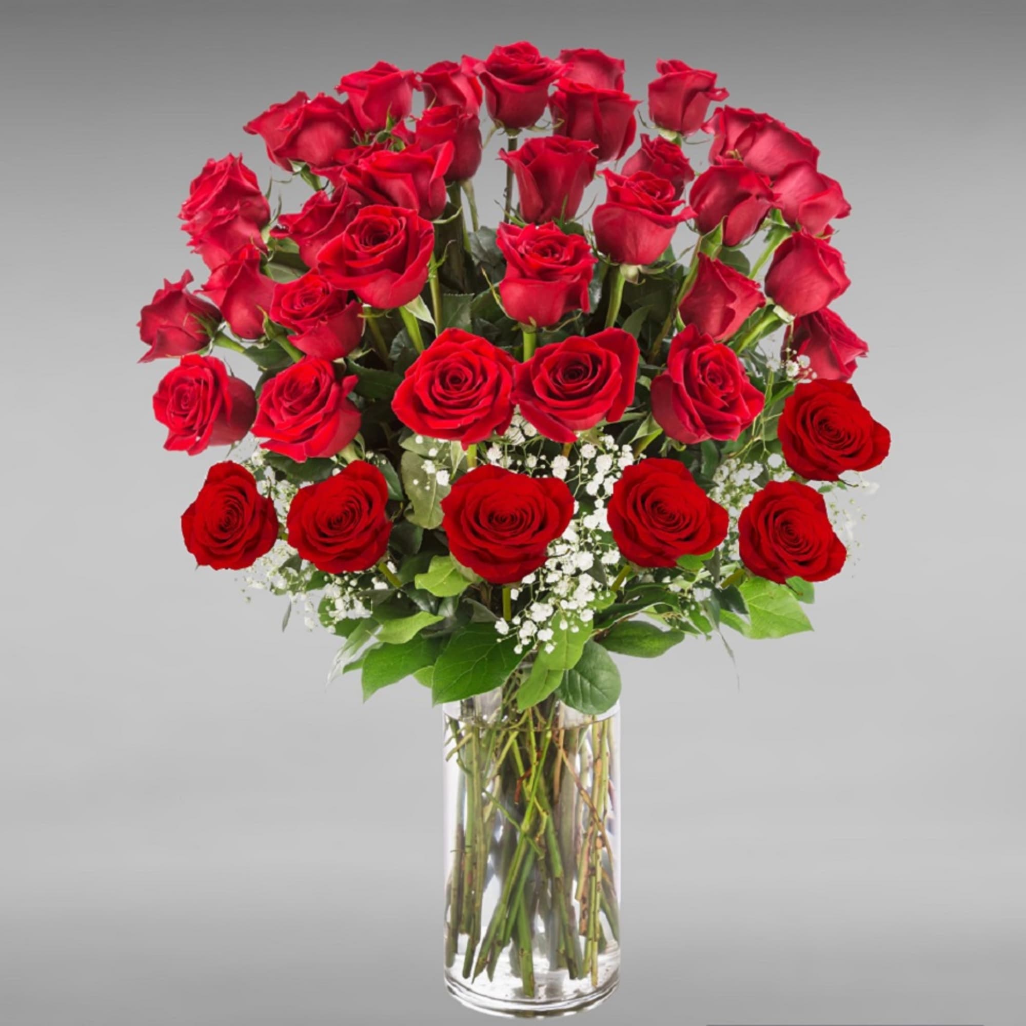 Go big with your love. Send the most extravagant red rose arrangement.