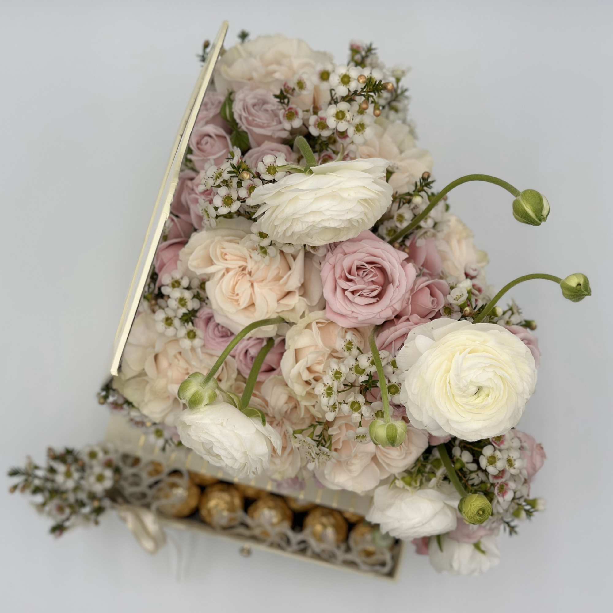 Ranunculus and Rose delicate combination for Spring! This piano box arrangement comes