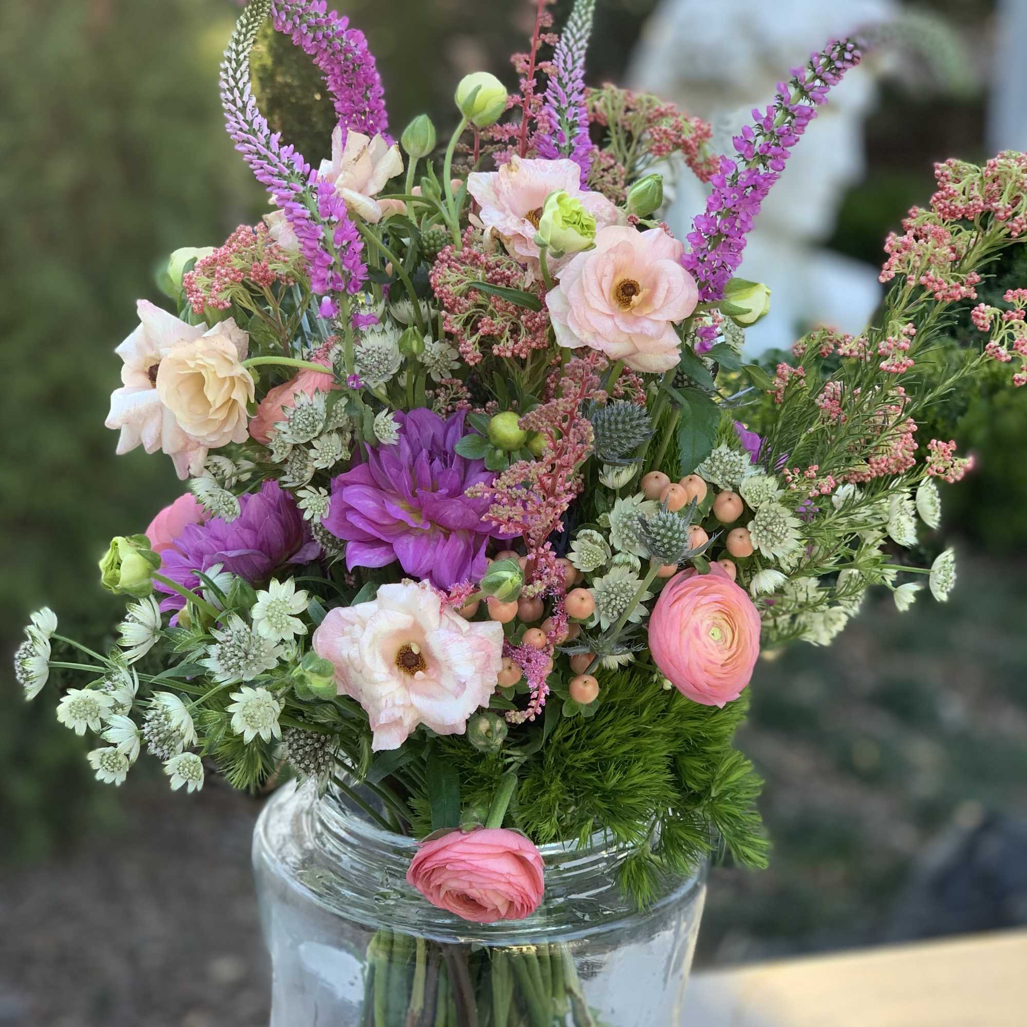 This sweet compact bouquet is bursting with all the bright colors of