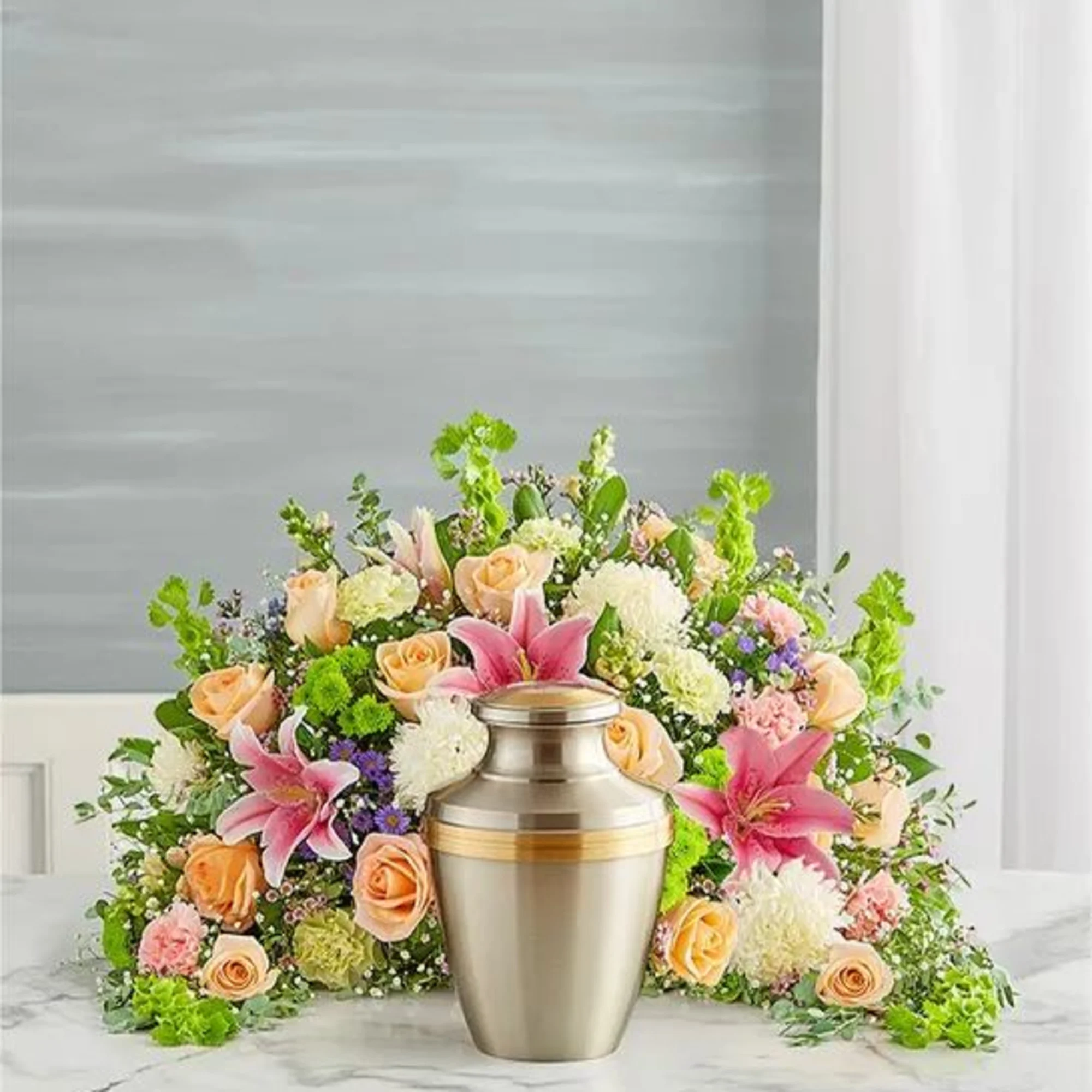 Express your heartfelt condolences with a beautiful floral tribute. Our crescent shaped