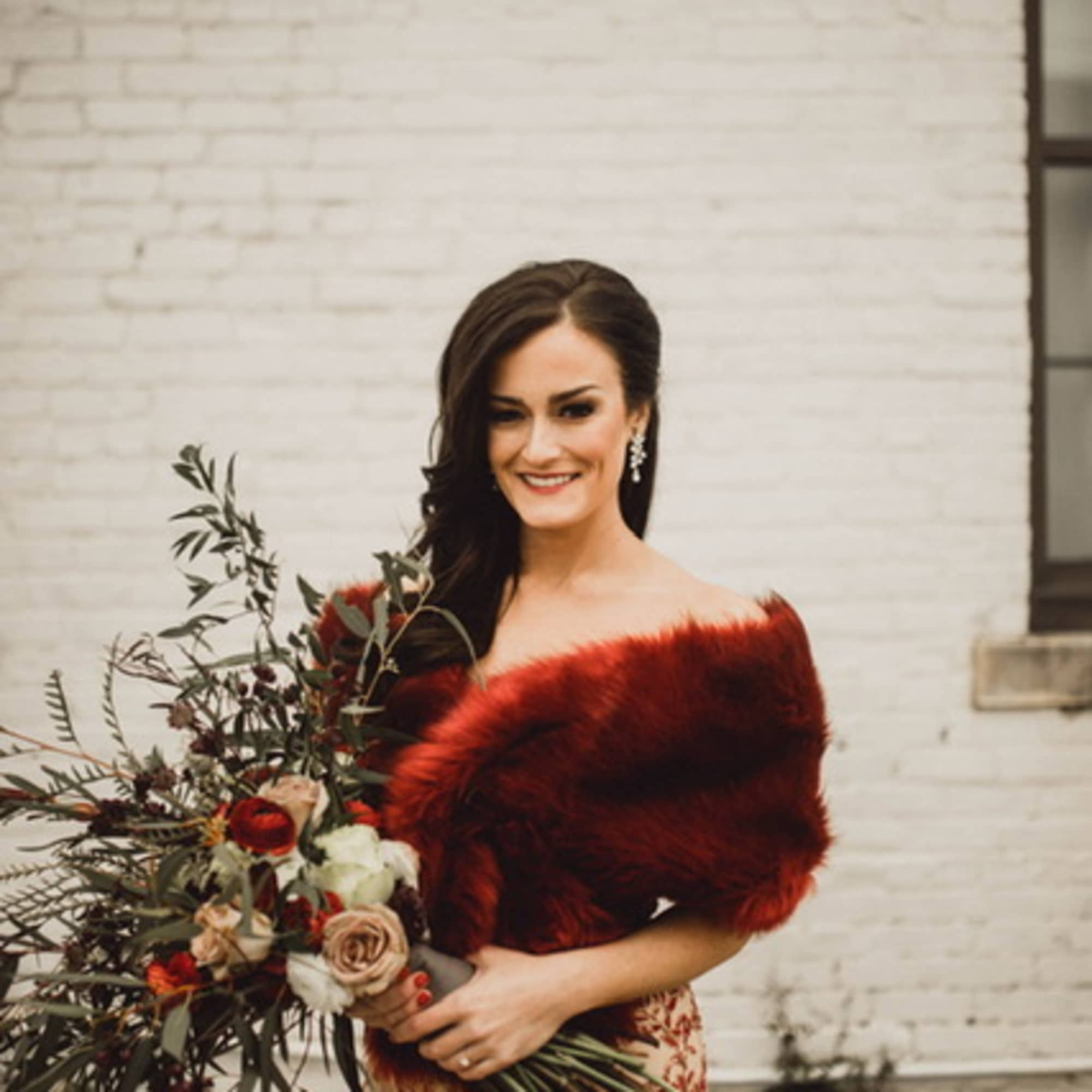 This striking bouquet is filled with drama and color. The deeply romantic