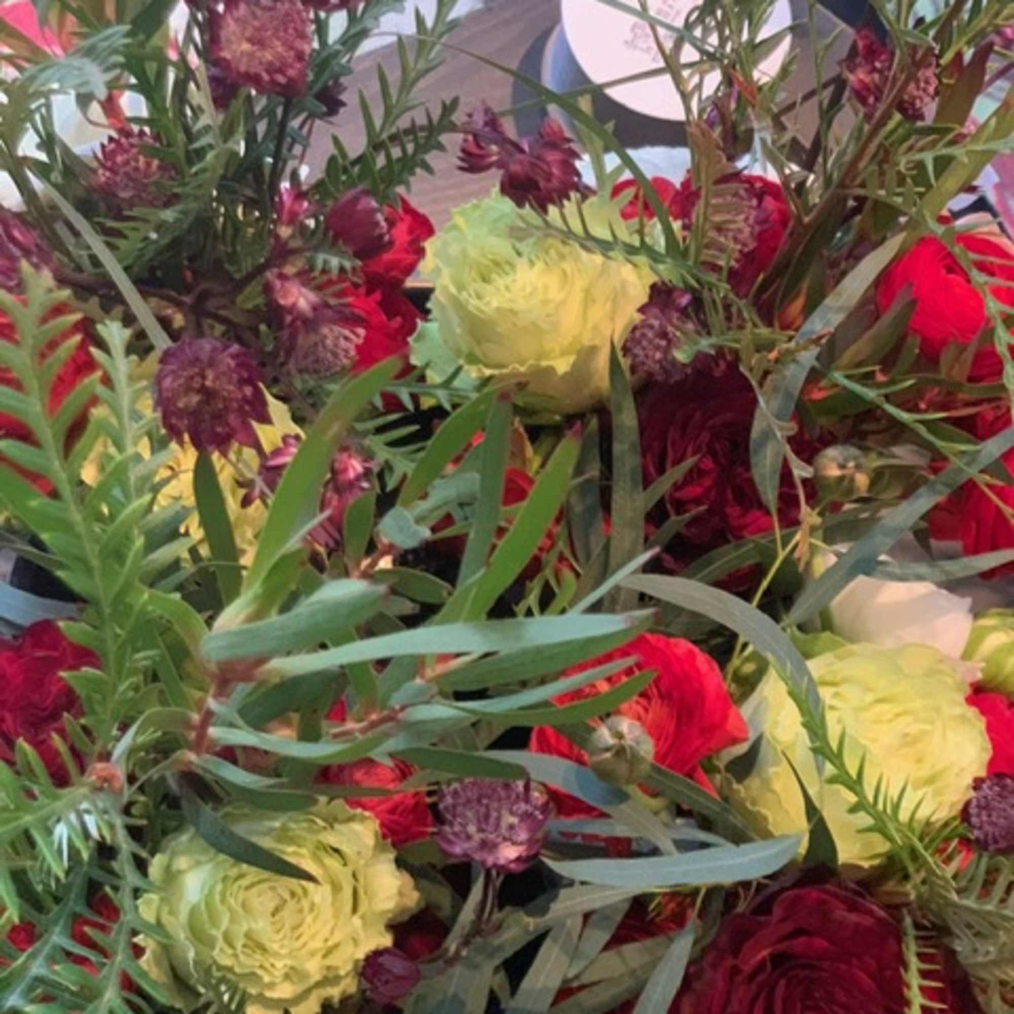 This striking bouquet is filled with drama and color. The deeply romantic