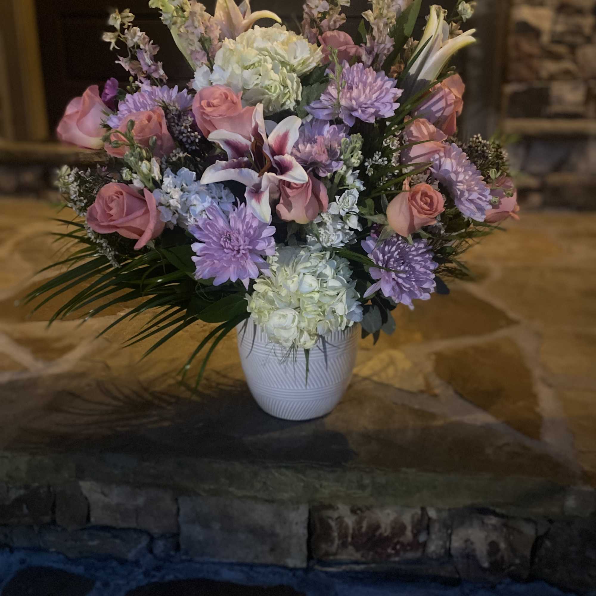 La Lovie has a medley of white, pinks & peach tones with La Lovie has a medley of white, pinks & peach tones with