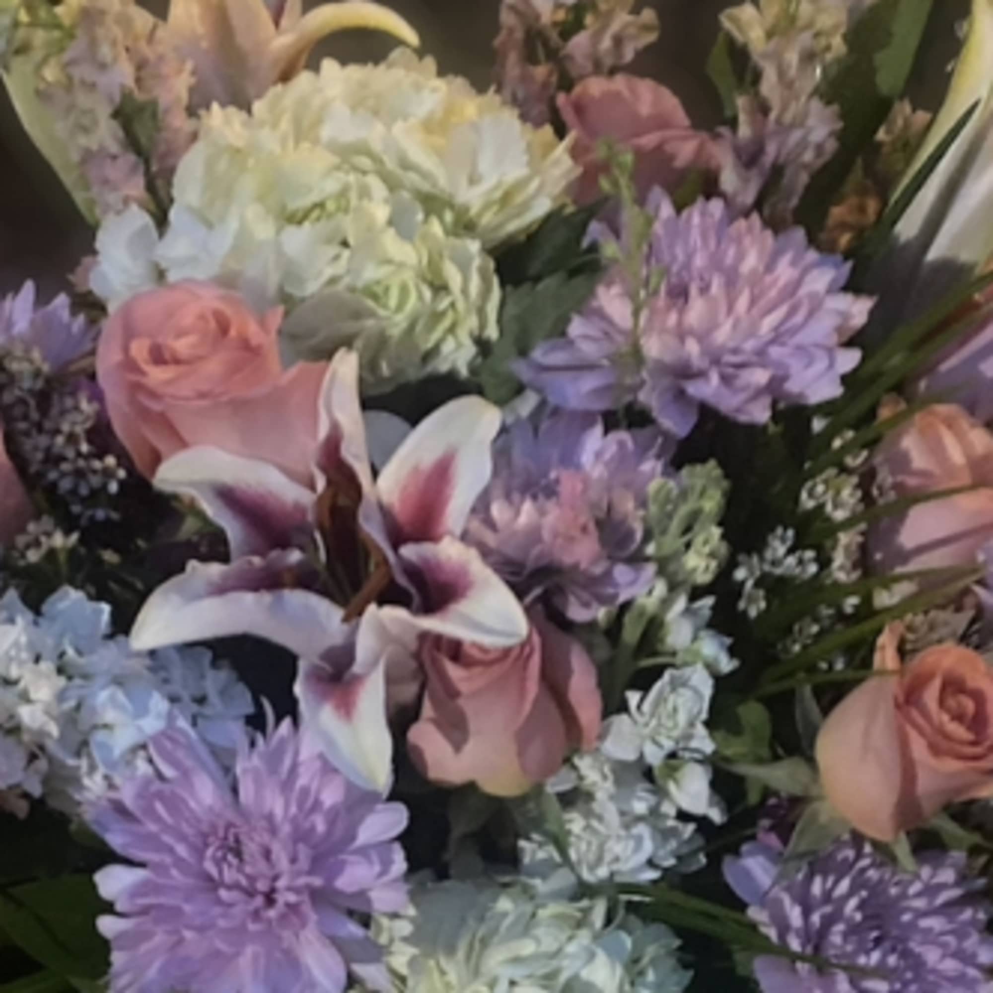 La Lovie has a medley of white, pinks & peach tones with La Lovie has a medley of white, pinks & peach tones with