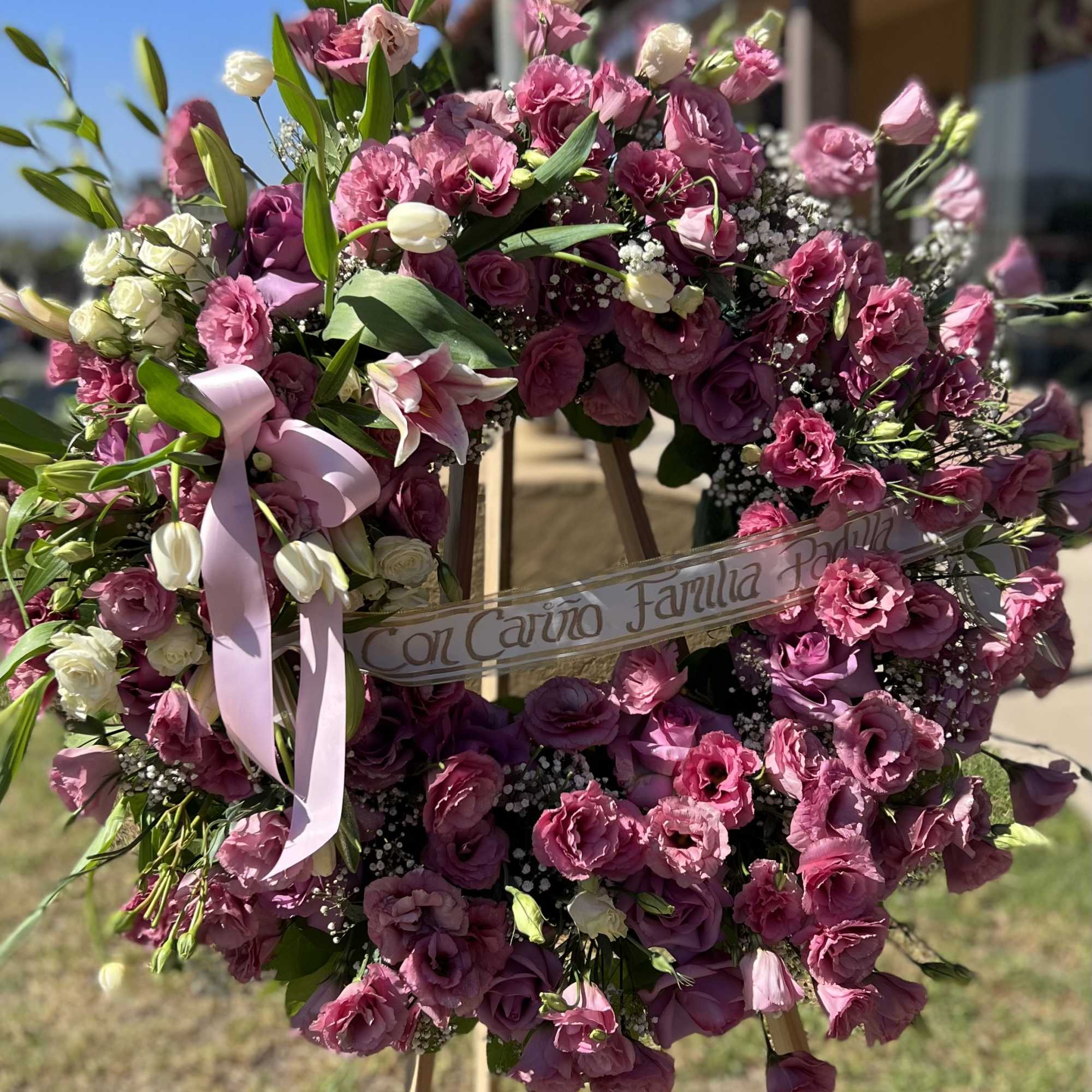 Fiusha, Dusty Pink, and Pinks Flowers.
36&quot; aprox. Ribbon, and Stand.
