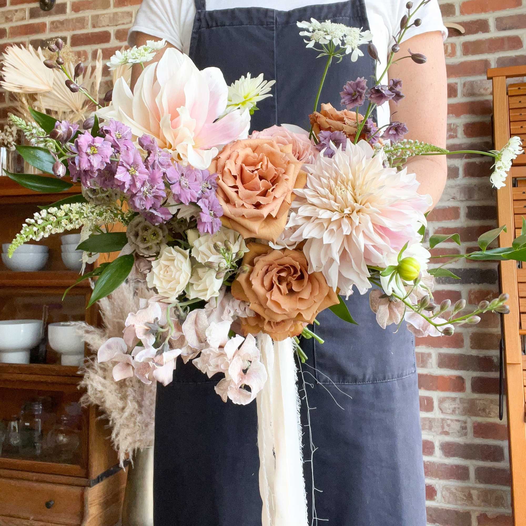 An airy blend of seasonal blooms in your wedding color palette. Featuring