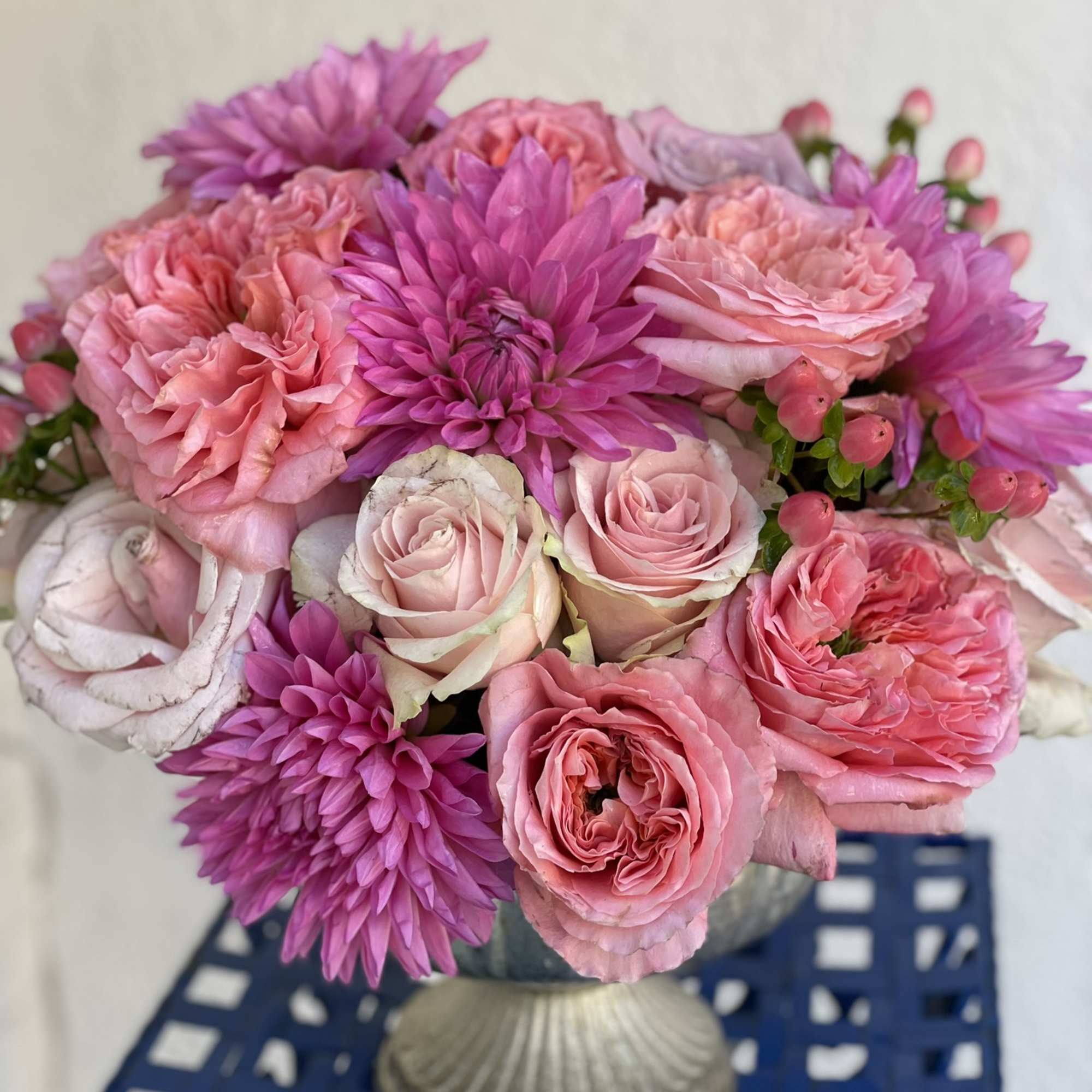 This stunning combination of roses and dahlias creates a compact, modern look