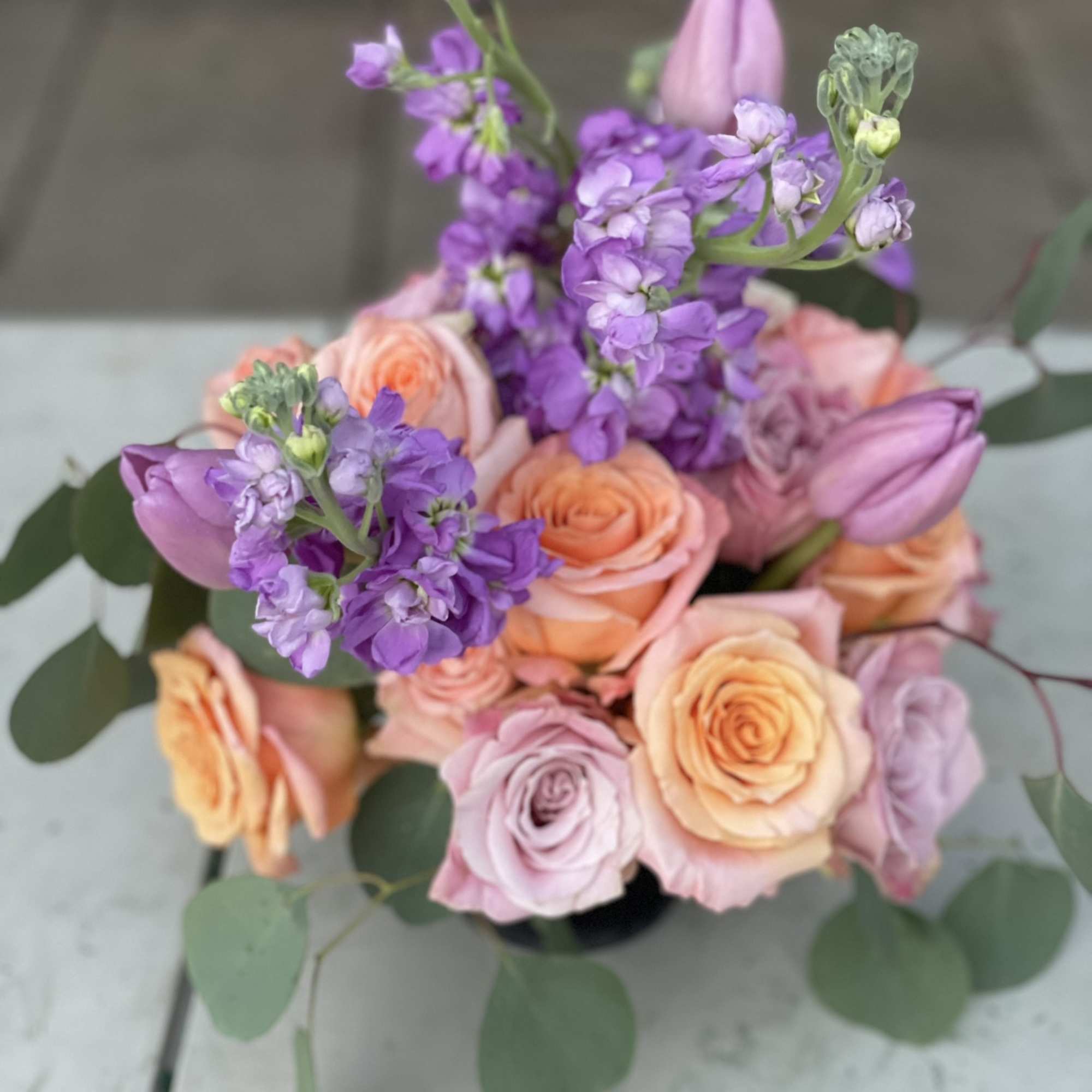 This combination of pastel roses, tulips and stock radiate happiness. The soft
