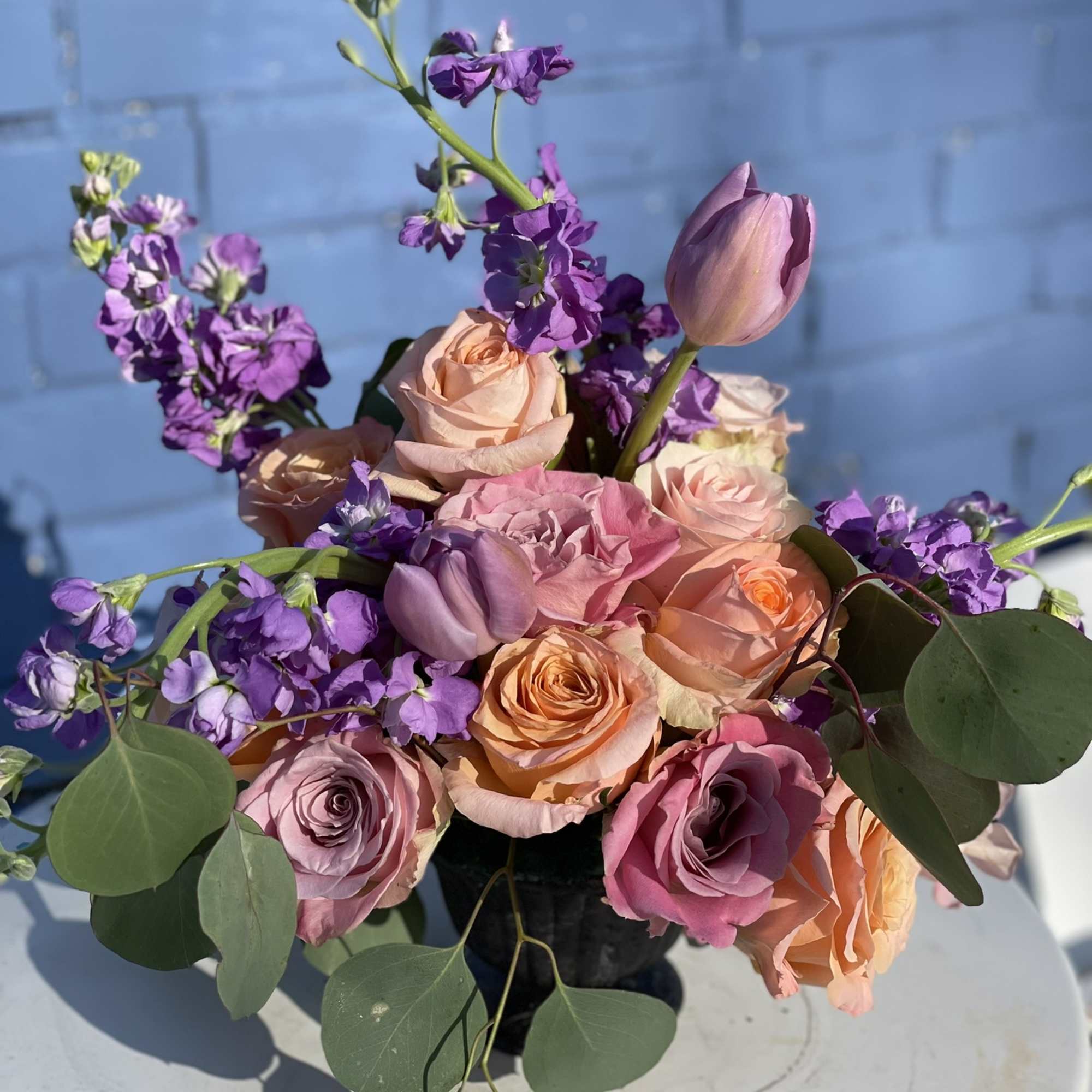 This combination of pastel roses, tulips and stock radiate happiness. The soft