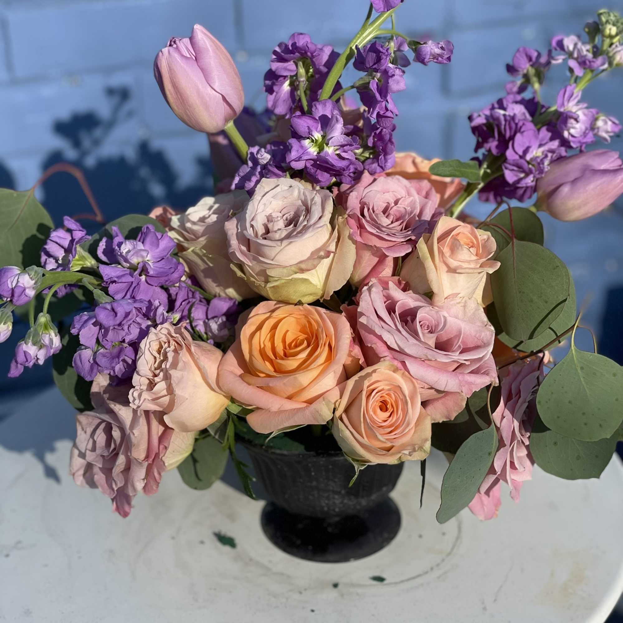 This combination of pastel roses, tulips and stock radiate happiness. The soft