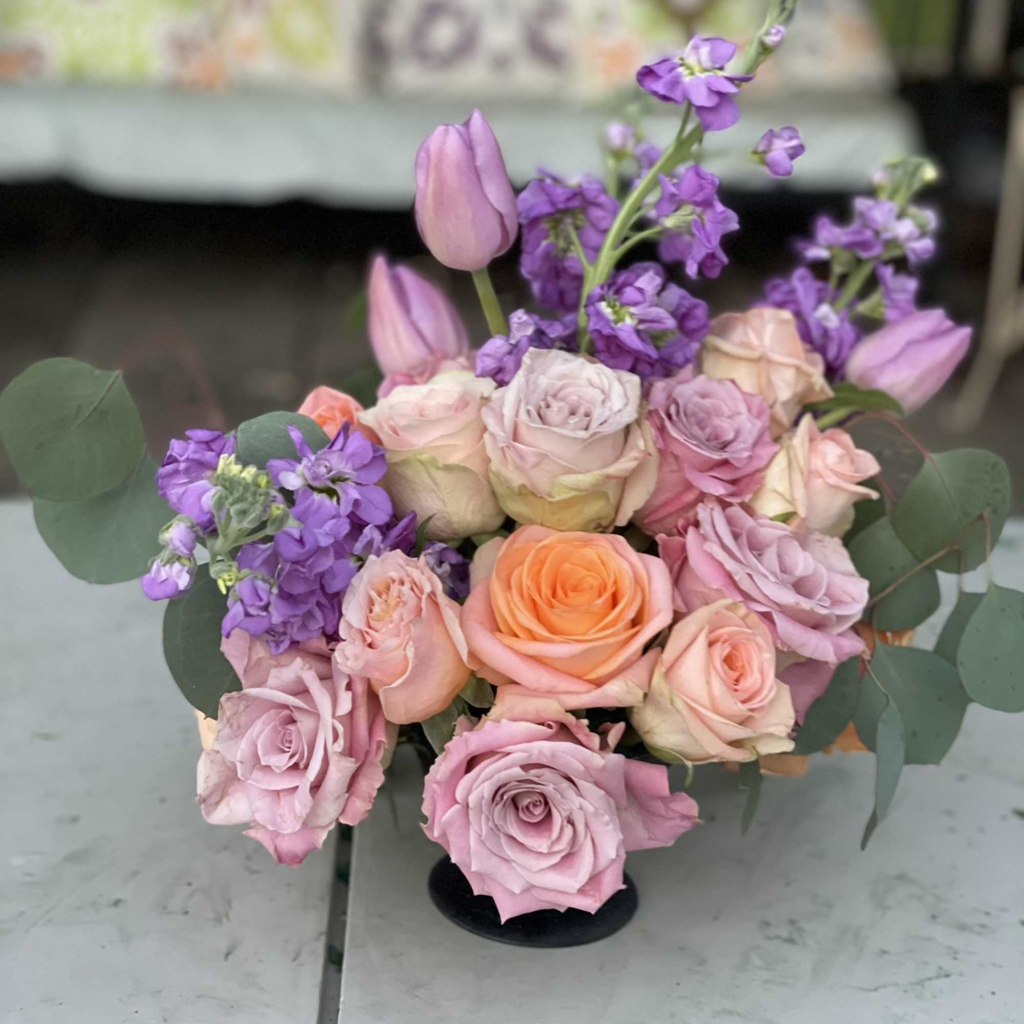 This combination of pastel roses, tulips and stock radiate happiness. The soft