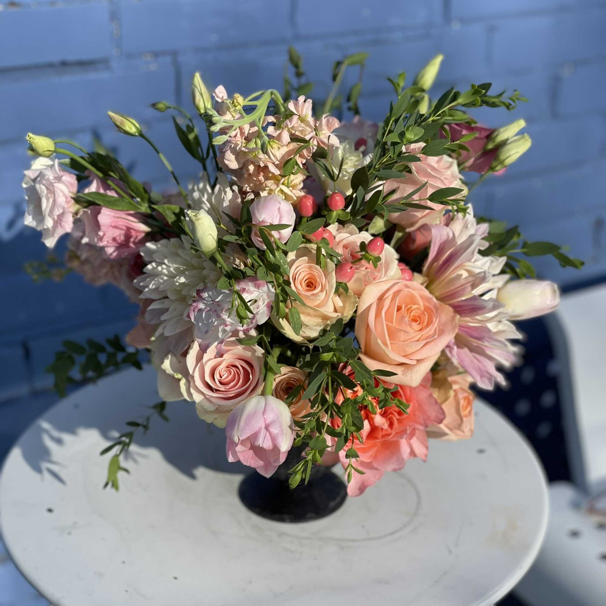 This fun and wild combination of blooms radiate in every tone of