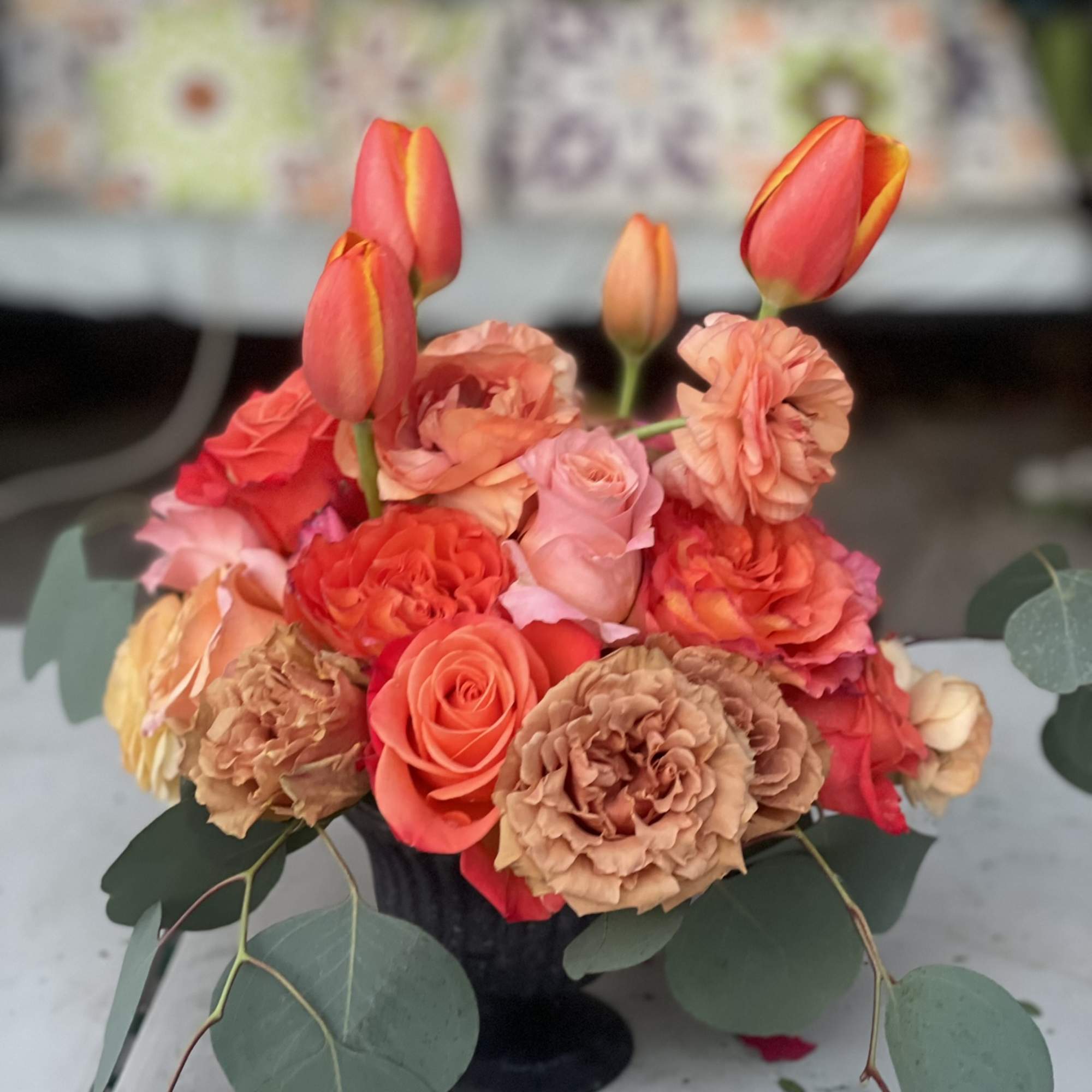 This unique and vibrant compact arrangement is bright and bold. Its unique