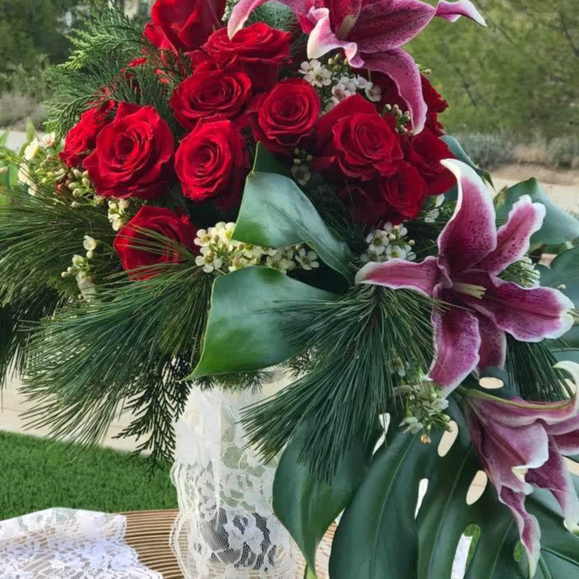 Red Rose and Lily Cascade Bouquet  will bring passion in style.


In